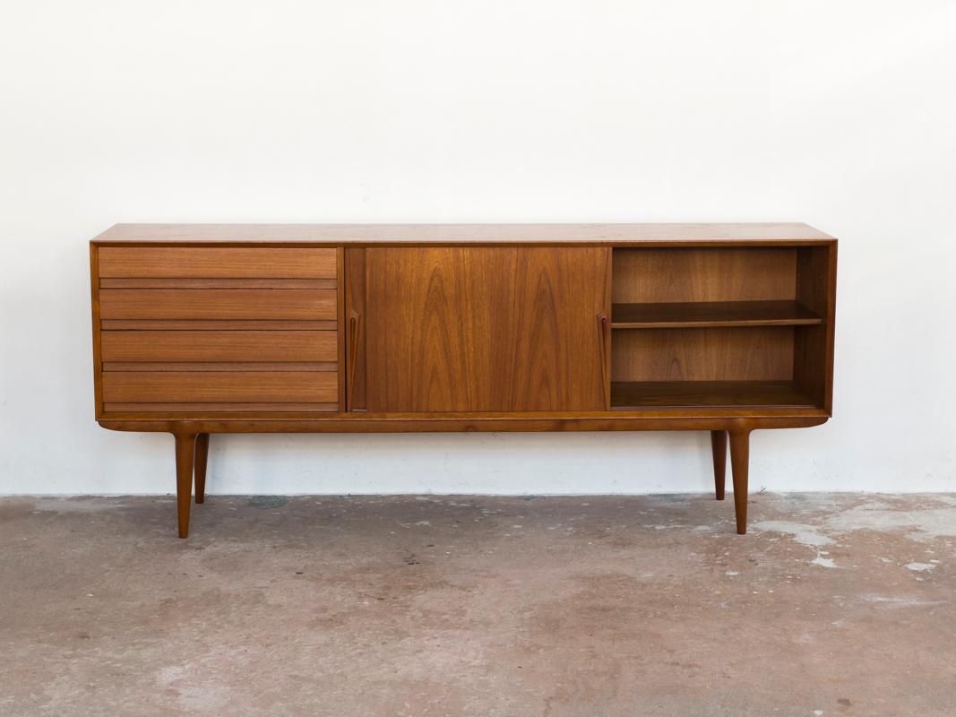 Midcentury sideboard Model 18 manufactured by Omann Jun in Denmark in the 1960s. The design has the perfect proportions for a sideboard. It is refined in every detail. This piece is labelled by the manufacturer with model number on the inside of the