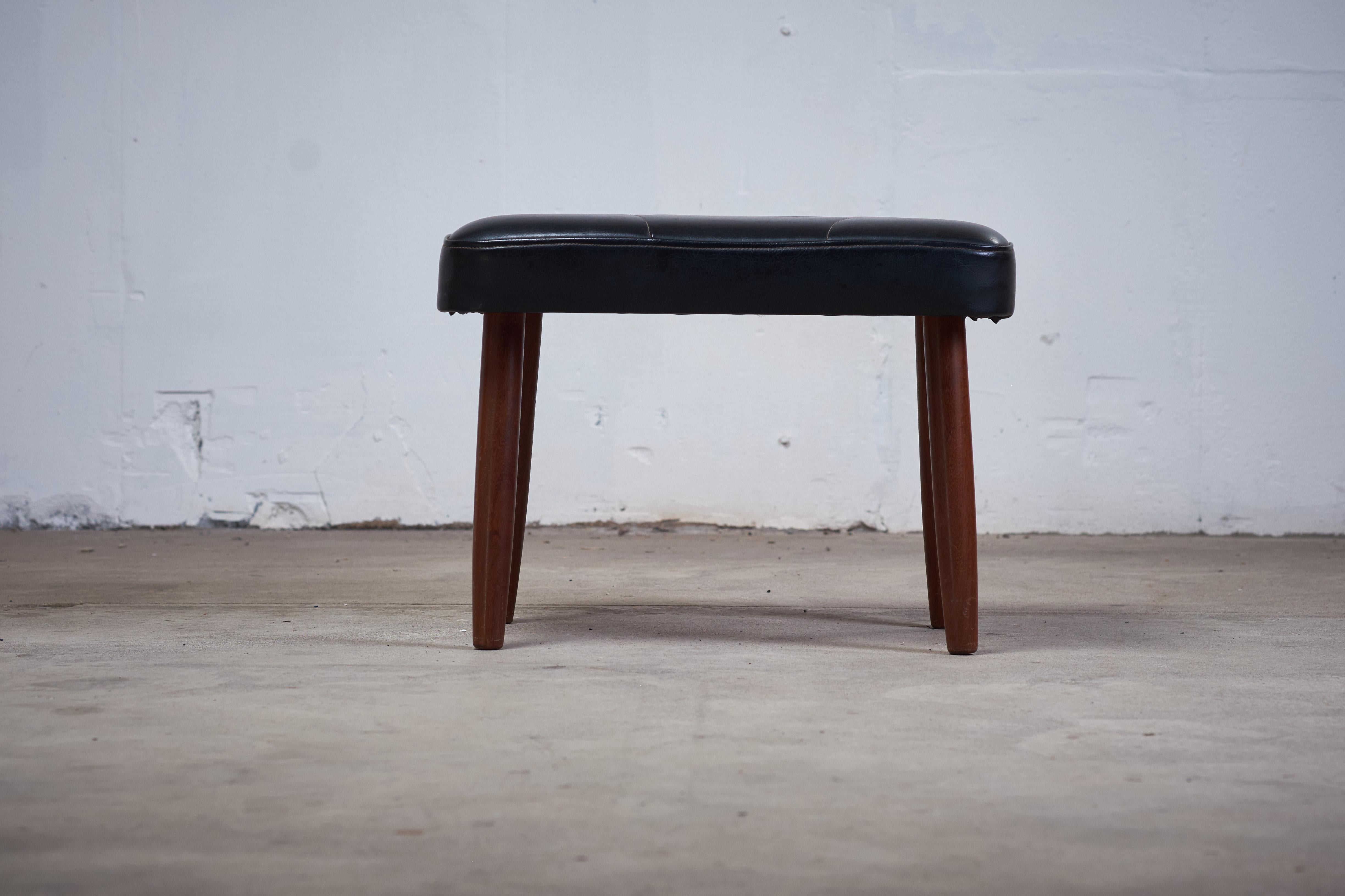 Stool in black artificial leather with pattern and legs in teak.
Danish midcentury design from the 1960s.
The stool are in good vintage condition.