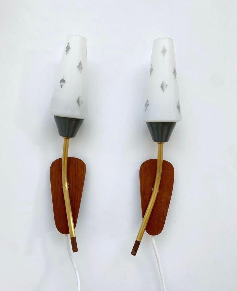 Danish Midcentury danish wall lamps made of teak wood, brass and milky glass 1960's  For Sale