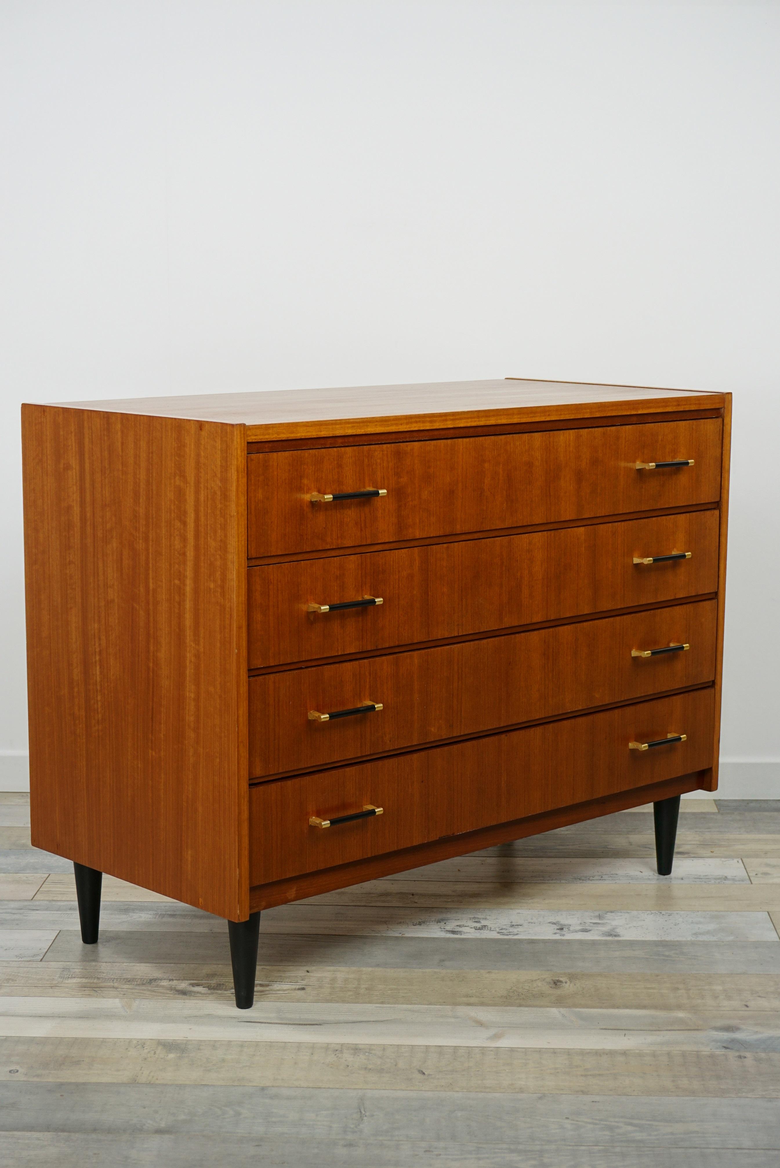 Teak wooden chest of drawers Scandinavian design from the 1960s, beautiful and practical. Sign of Fine, delicate and quality work: its brass handles and compass feet. All in excellent condition.