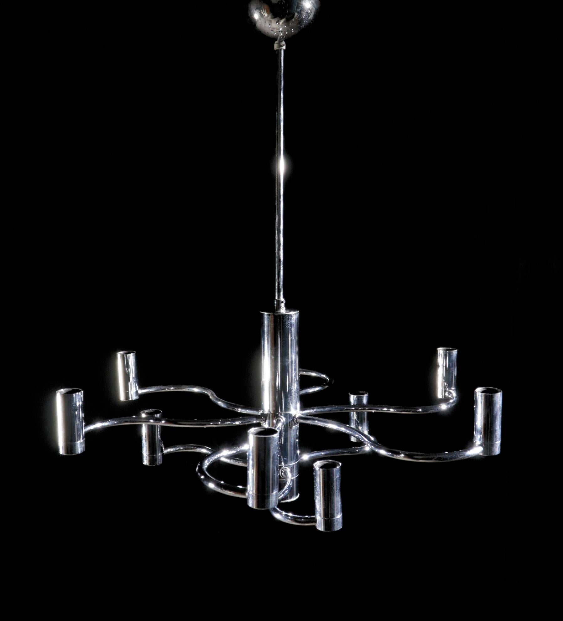 Midcentury design ceiling lamp / chandelier by Gaetano Sciolari from the 1970s.
The lamp has 9 light points and gives beautiful lightning by the reflections on the chrome.