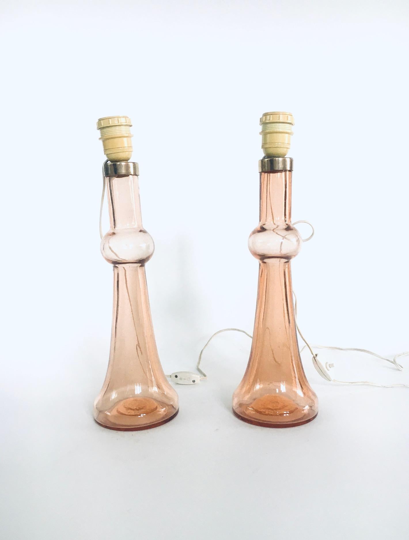 Vintage Midcentury Design Glass Table Lamp set by Nanny Still for Raak, Amsterdam, Netherlands, 1960's / 70's. Peach color glass lamp base with original fittings. Set of 2 lamps. Handmade glass, which makes them slightly different in color