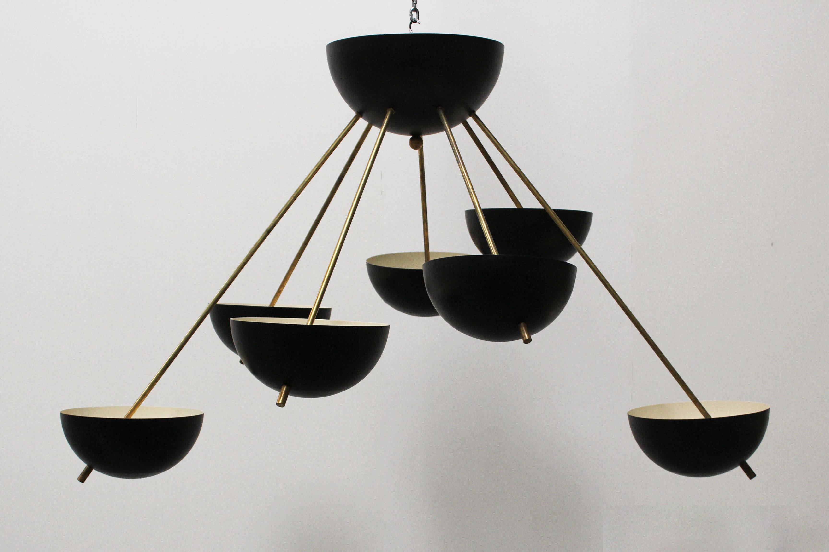 Magnificent midcentury design Sputnik chandelier in design of 1960s Stilnovo
It has a wonderful minimalistic Stilnovo design with lines inspired by the Space Age
The chandelier has seven sockets and is fully rewired. Brass shows small sings of age.