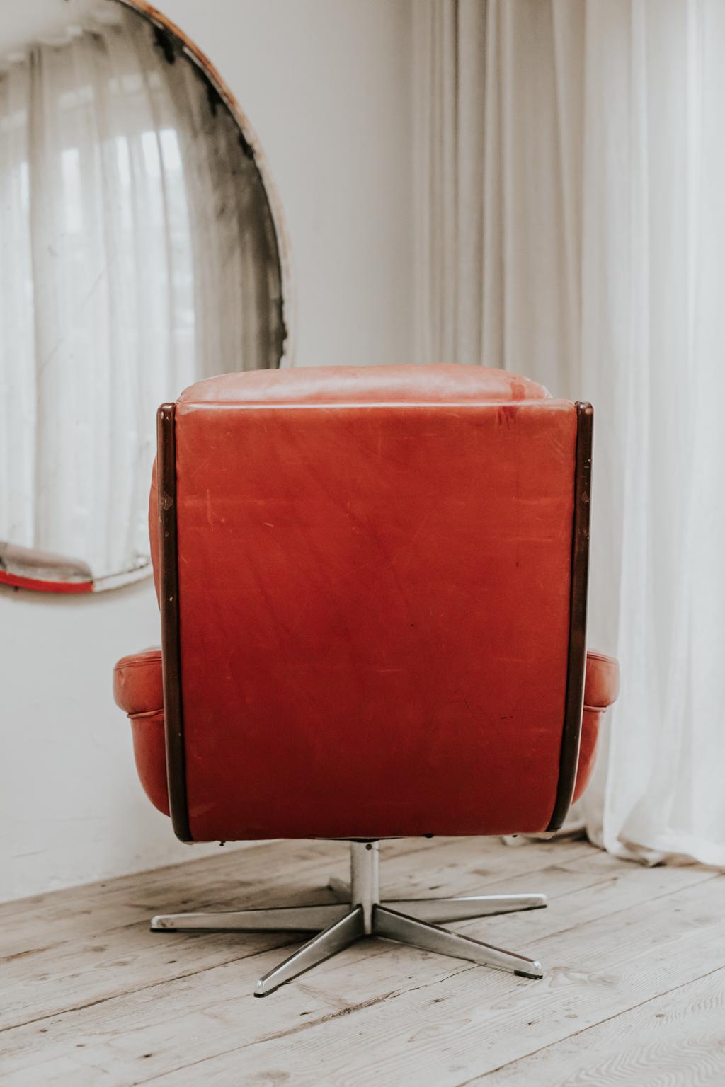 red swivel armchair