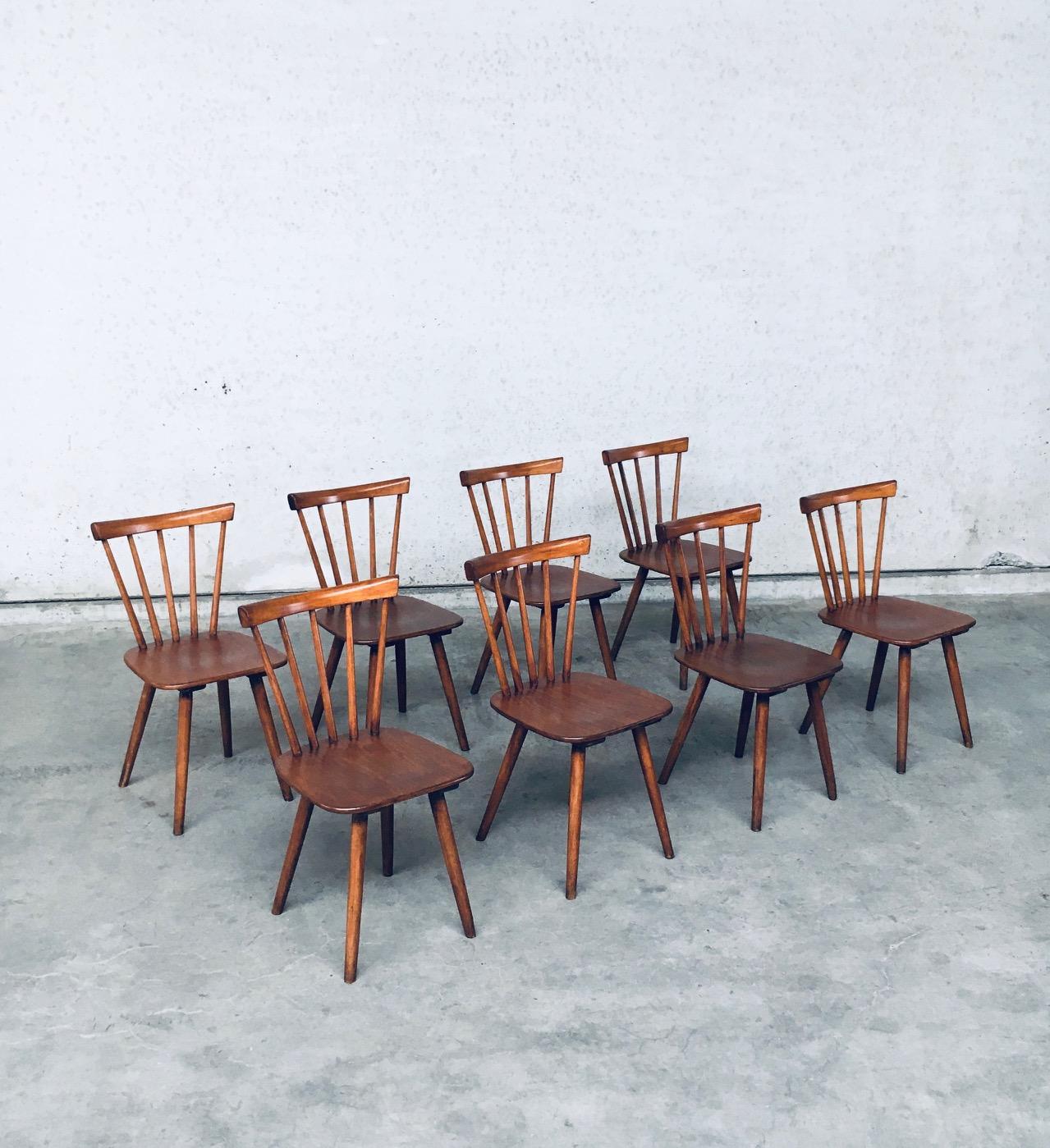 Vintage Midcentury Dutch Design Spindle Back Café Chairs by Vervoort Tilburg. Made in the Netherlands, 1950's / 60's. Set of 8 chairs. Elm or Beech constructed chairs with stamp of their maker on the bottom (faded on most chairs). All chairs are in