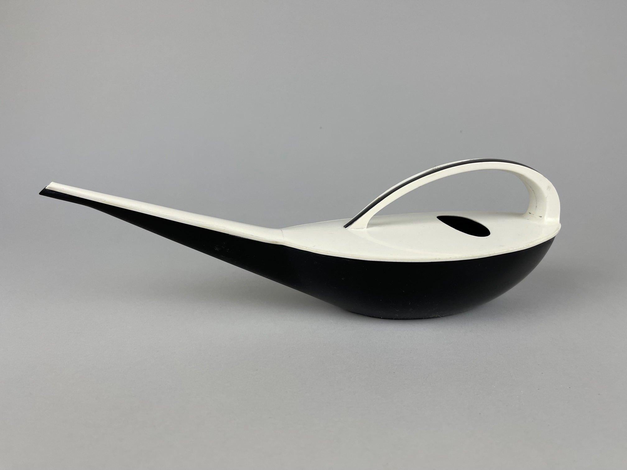 Beautiful plastic watering can designed by Klaus Kunis in the 1960's. Made at the Glass Factory in Zittau. 
Its original, delicate shapes are reminiscent of the very popular design period after the 1958 Brussels Expo.