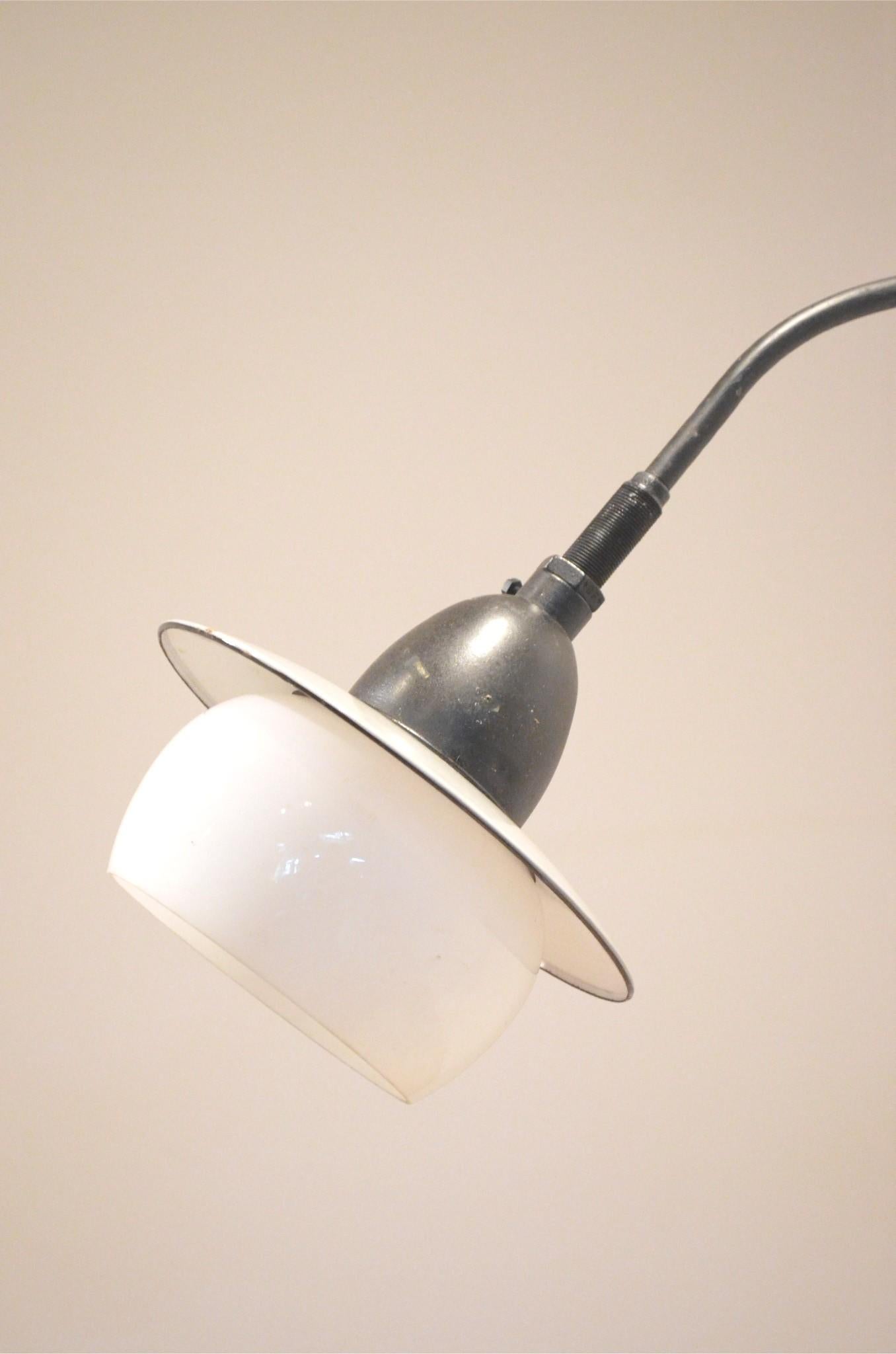 Extra large sized midcentury industrial wall arm lamp produced by Philips – model ZAL 30/02 – black painted metal arm matched with grey enameled top with opalescent glass diffuser.