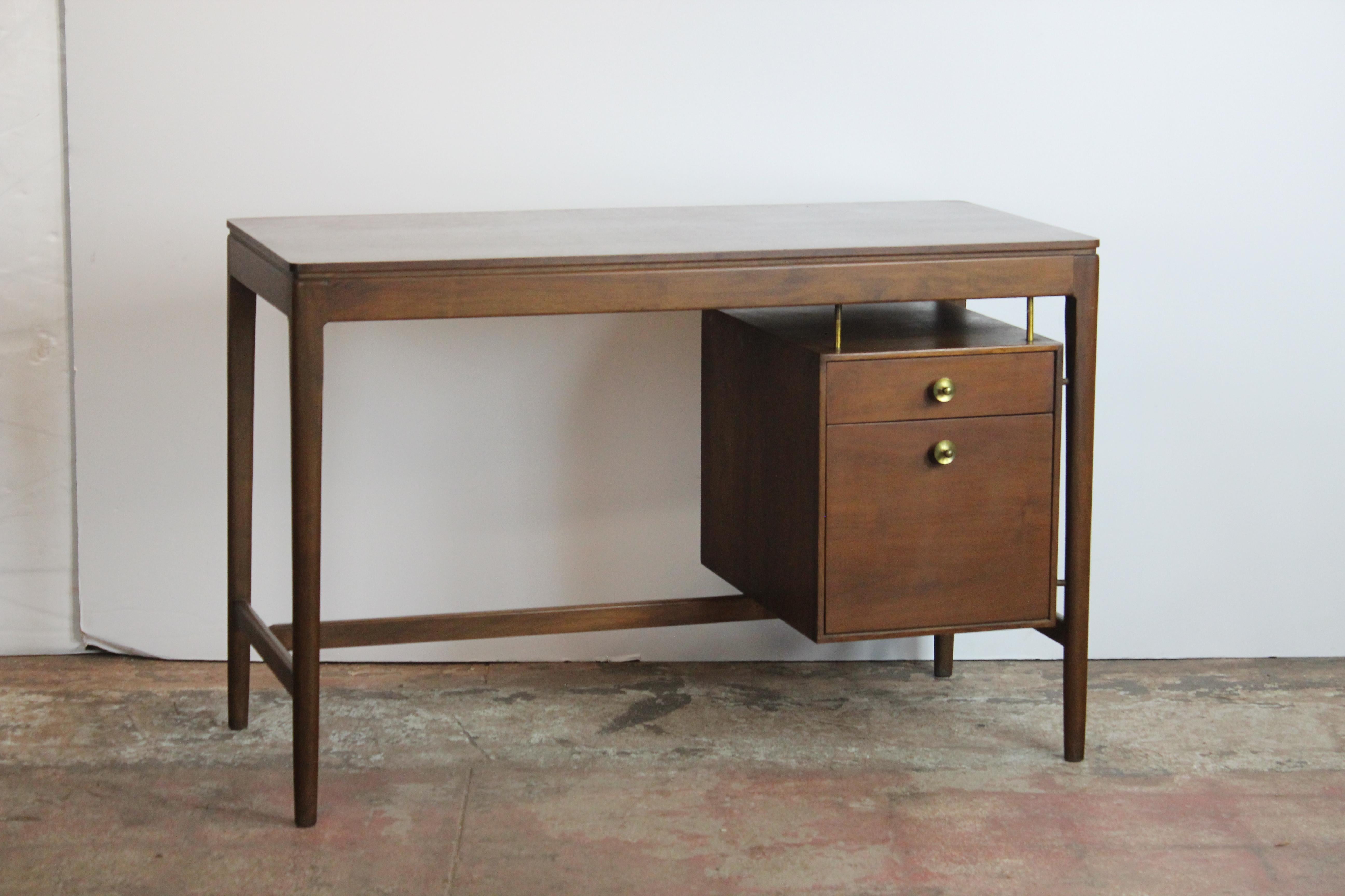 Midcentury desk by Drexel. The chair has cane seat and brass accent. Measures: Chair 21