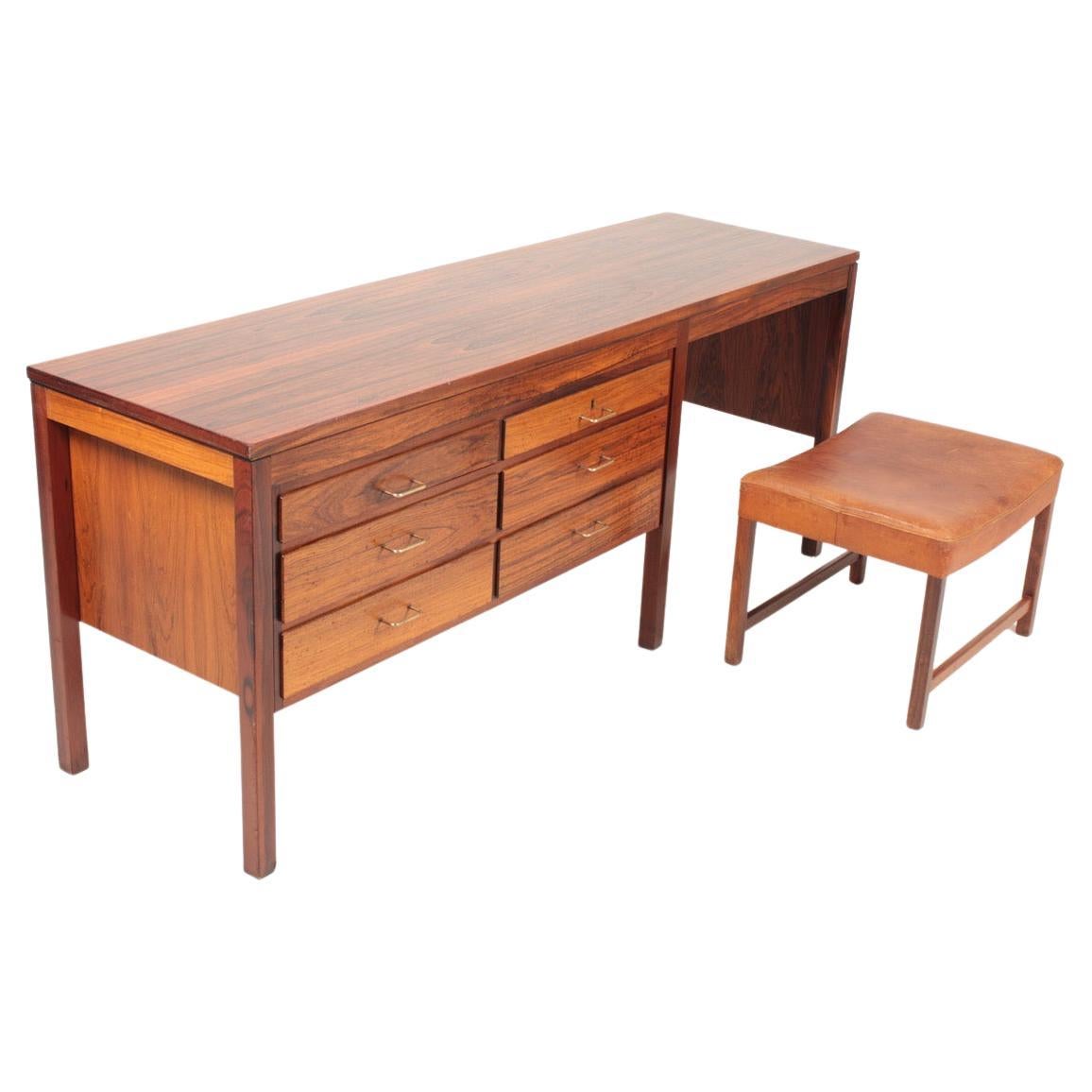 Desk and stool in rosewood designed and made in Denmark in the 1960s. Great condition.
