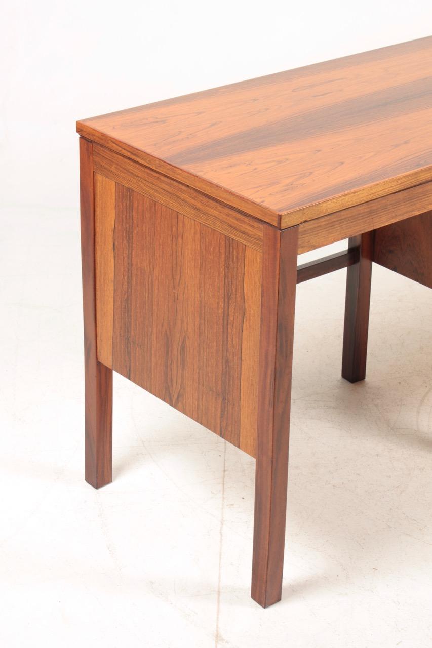 Desk in rosewood designed and made in Denmark in the 1960s. Great condition.