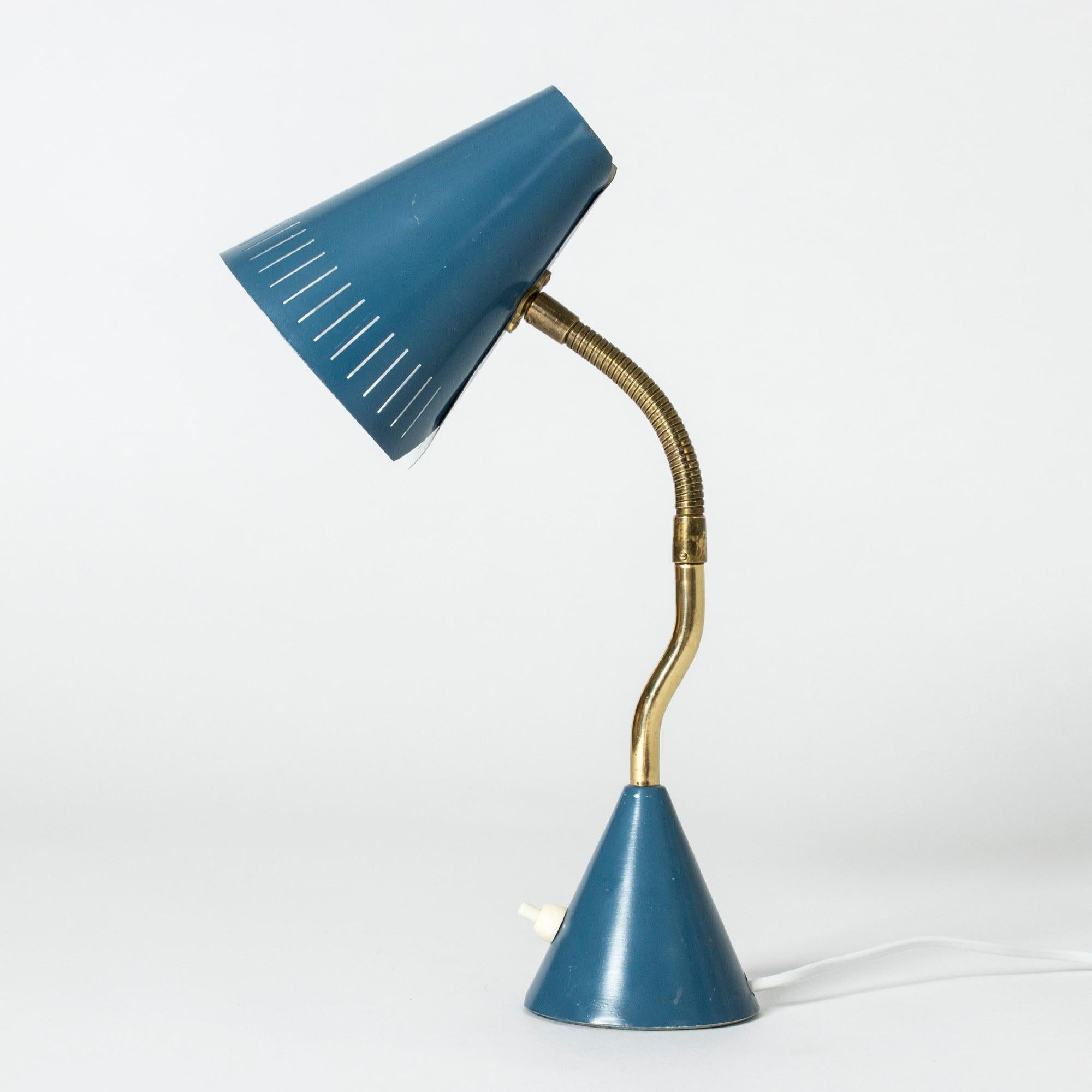 Elegant desk lamp from Falkenbergs Belysning in a beautiful teal color and brass neck. Neat wraparound design of the shade.