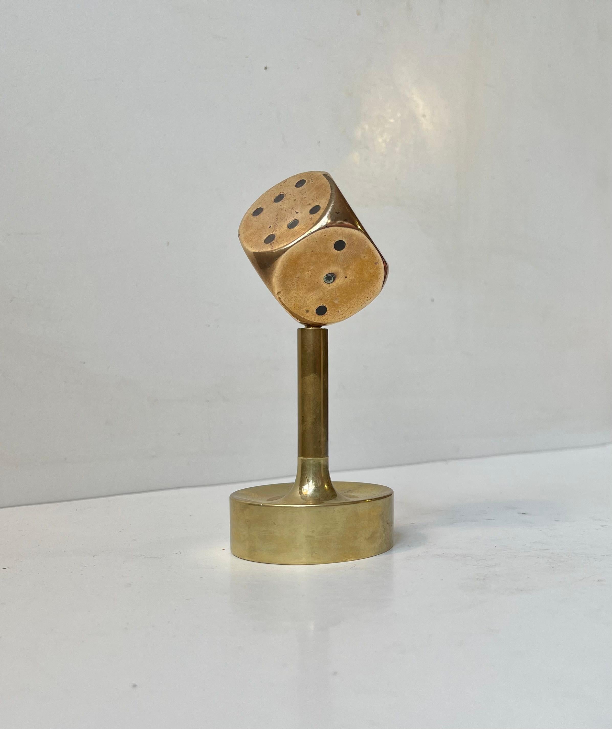 Small unusual desk sculpture with removable bronze dice. Despite its small size its very heavy. The dice may have been mounted as a hood ornament originally and then made in to a decorative piece by an unknown probably Scandinavian metalworker.