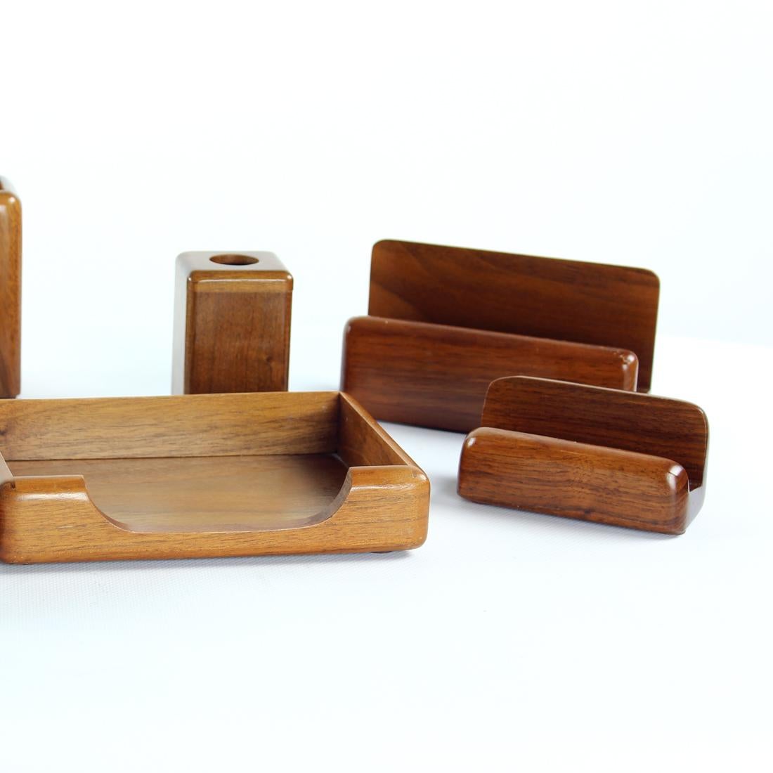 Beautiful vintage desk set produced in Czechoslovakia and marked as INKA, as an original label. Trully a beautiful set made completely out of walnut wood. The set consists on a paper holder, pen holder (cup), pensil holder, card holder, little