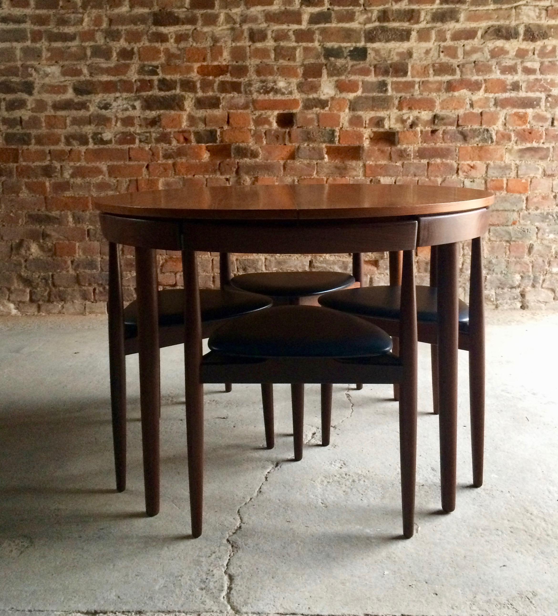 Magnificent midcentury 'Dinette' dining table designed by Hans Olsen and manufactured by Frem Rojle in Denmark during the 1950s. The table is made from teak and features an extending mechanism complete with six chairs circa 1960, makers stamp