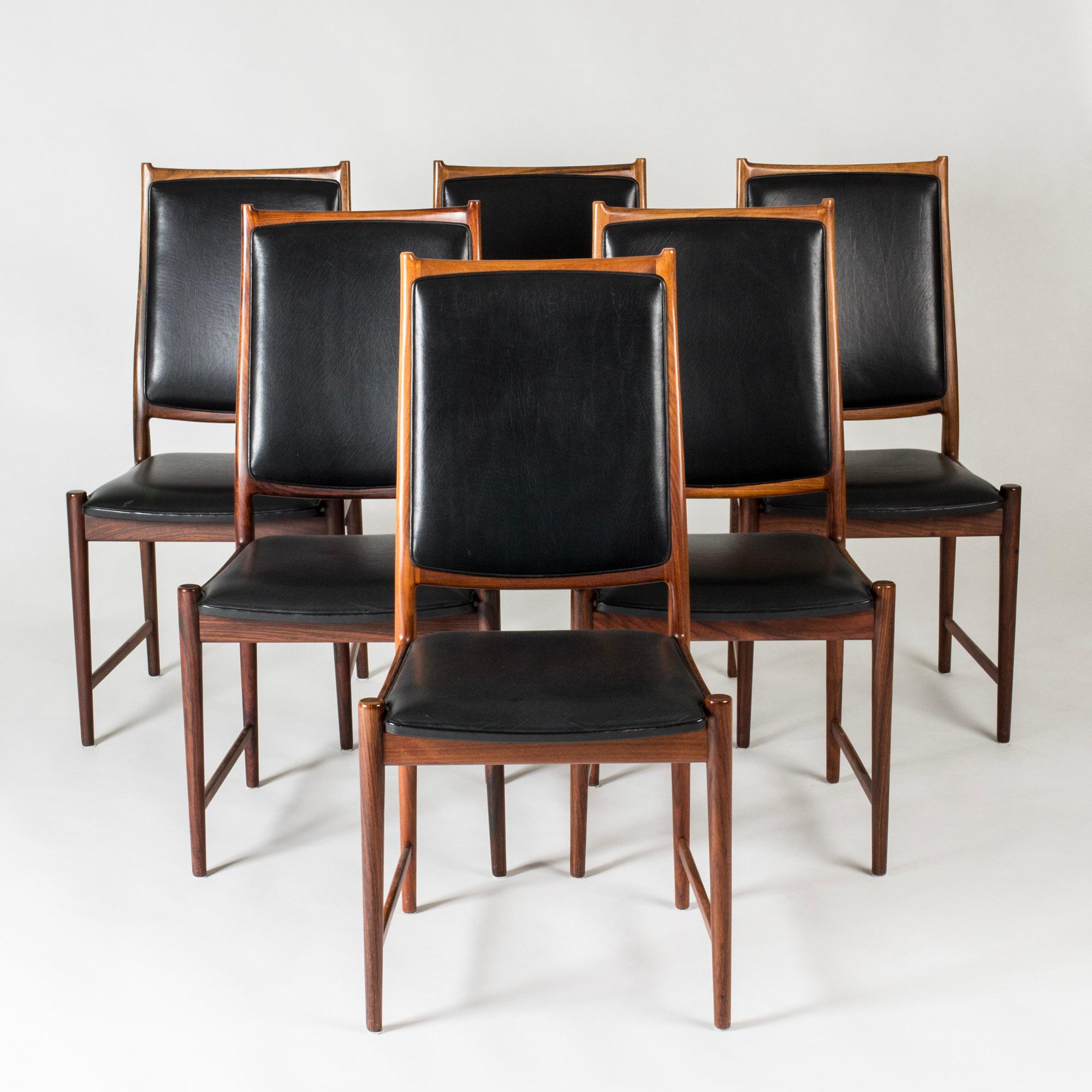 Set of six beautiful dining chairs by Torbjørn Afdal, made from rosewood with lovely rich brown woodgrain. Leather seats and backs, elegantly framed by the wood.