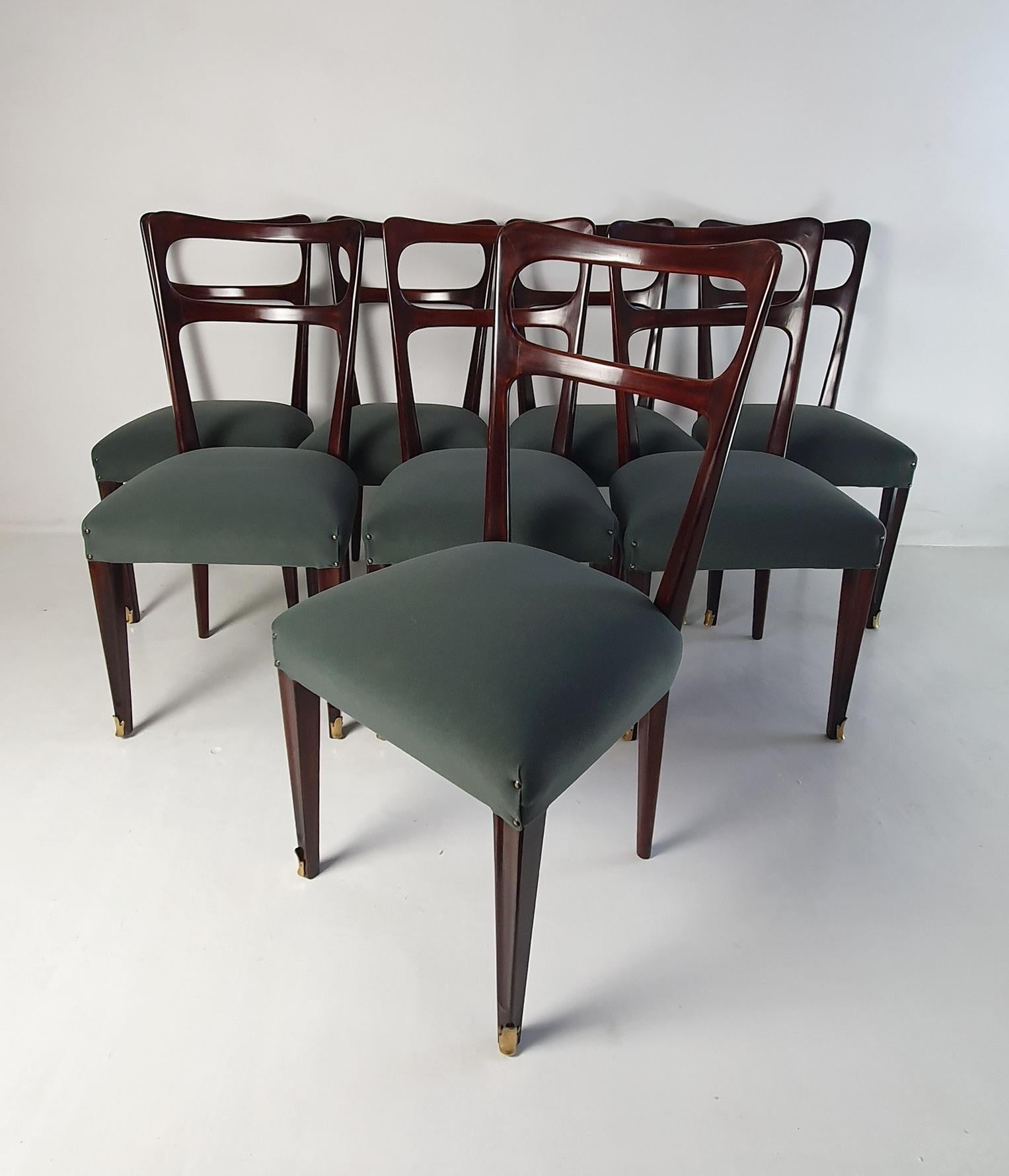 This set of eight mid-century Italian dining chairs is a stunning example of elegant design and supreme craftsmanship. The chairs have recently undergone a professional restoration and reupholstery, ensuring that they are in excellent condition and