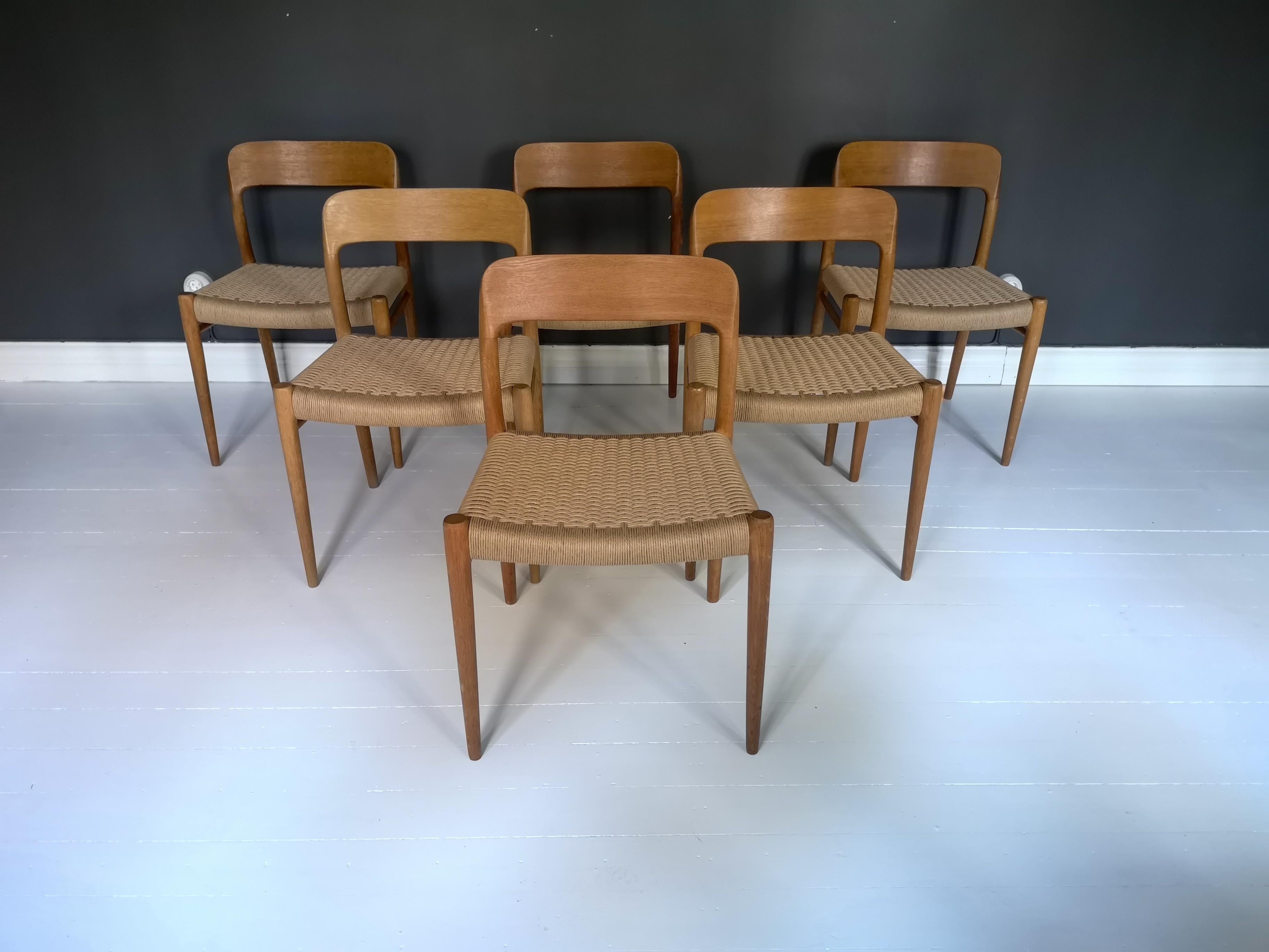 These beautiful set of dining chairs designed by Niels O. Møller, was manufactured by J.L. Møllers in Denmark. The set features 6 chairs of massive oak wood and paper cord seats, model 75, one of the
all-time great dining chairs to come out of the