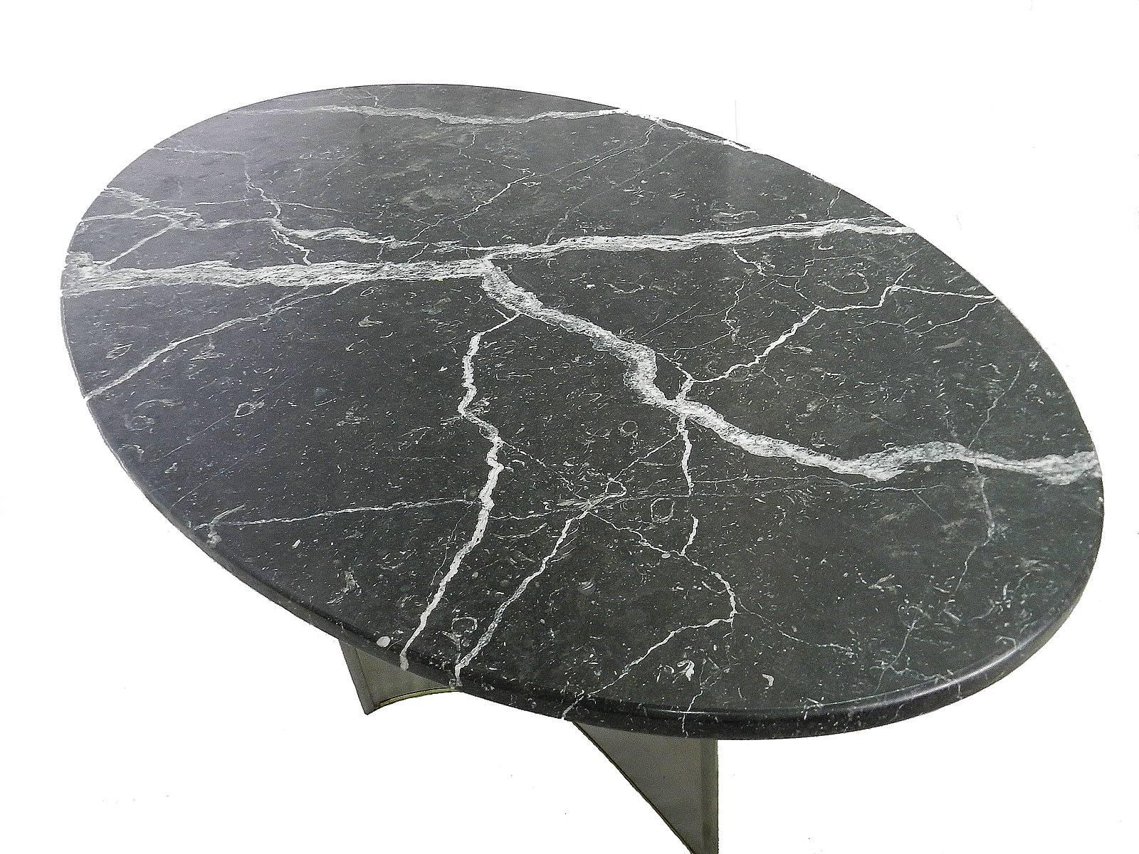Midcentury dining table marble metal base, circa 1970 in the manner of Maison Jansen.
In our opinion this stunning table is probably by Maison Jansen
Very unusual being an oval table very like their smaller circular ones of the same design
Good
