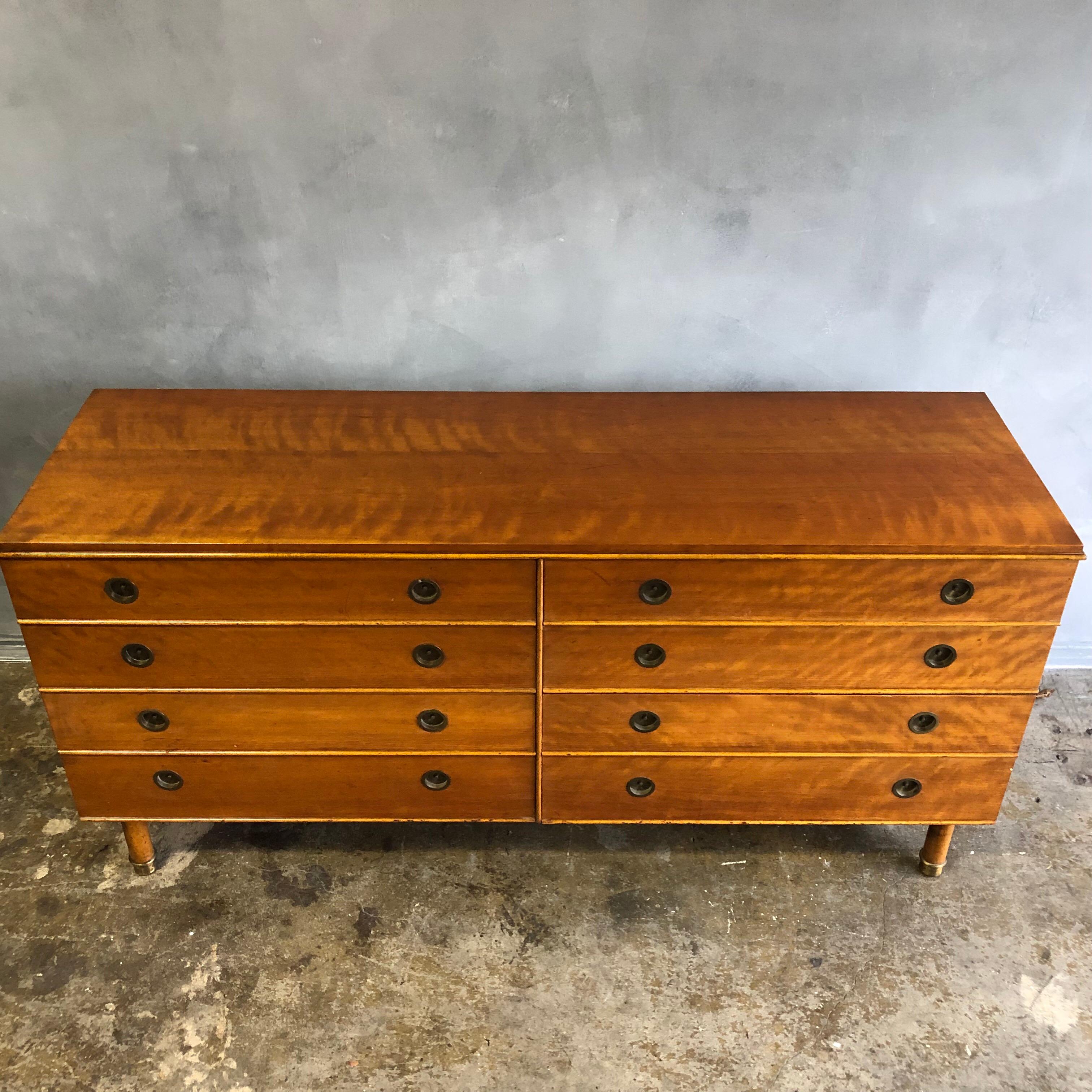 Highly crafted dresser using solid wood with brass details. In original condition with excellent patina.