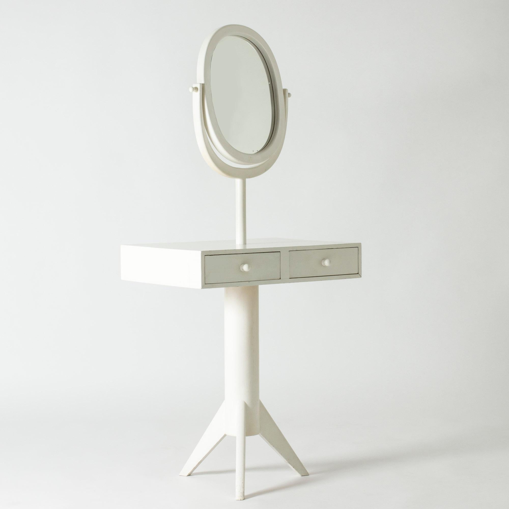 Lovely dressing table by Erik Höglund, in a whimsical design with smooth lines. The table top stands on a piedestal base, cute knobs on the drawers and on the sides of the mirror.

Erik Höglund was one of Sweden’s foremost glass artists, whose