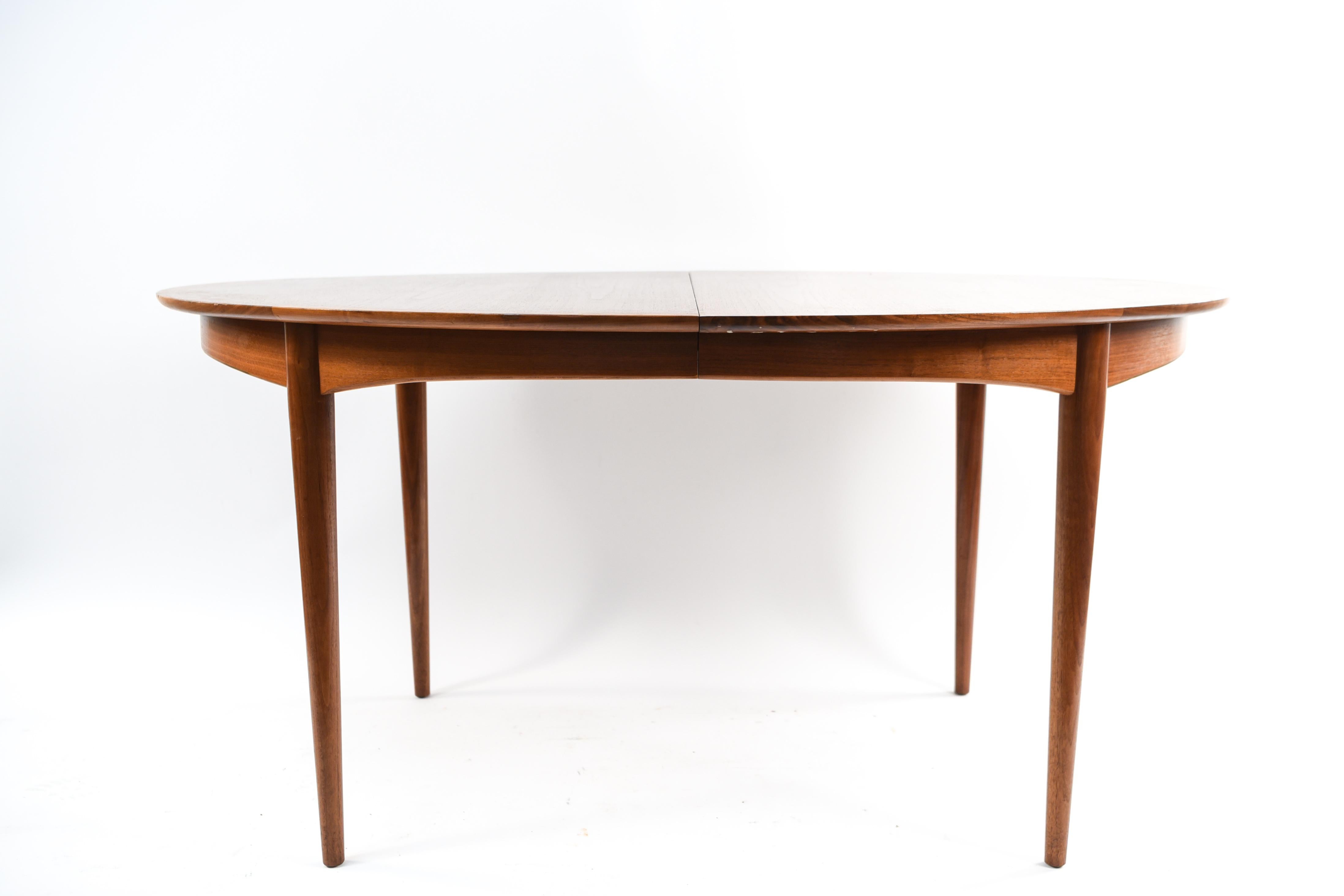 This attractive midcentury dining table includes two 18