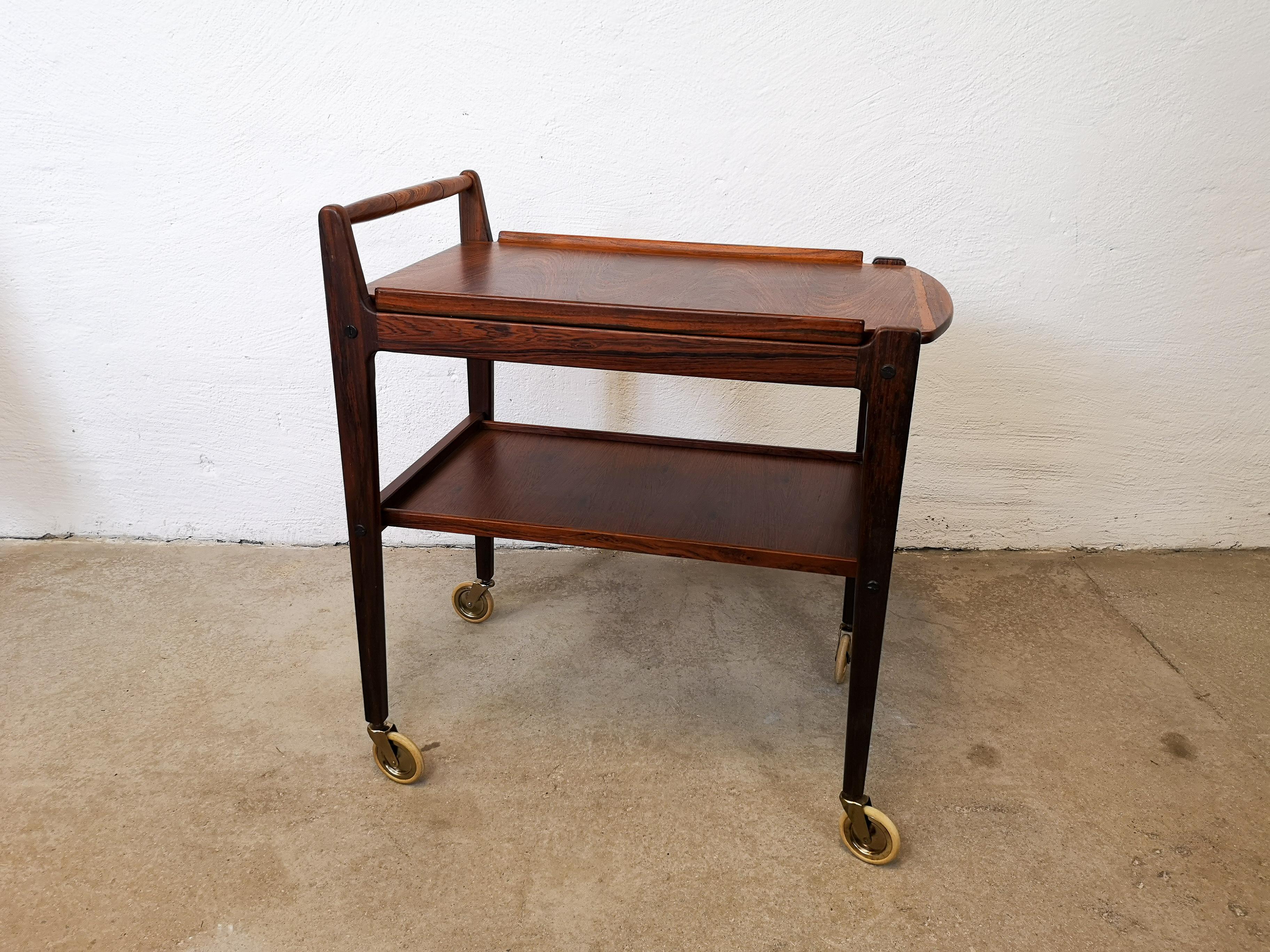 Wonderful midcentury drink trolley made in rosewood with a tray with the possibility to take it off. 
It was produced in Sweden in the 1960s at Erik Gustafssons Furnitures Sweden. 
Stamped made in Sweden 

Good vintage condition. 

Measures: W