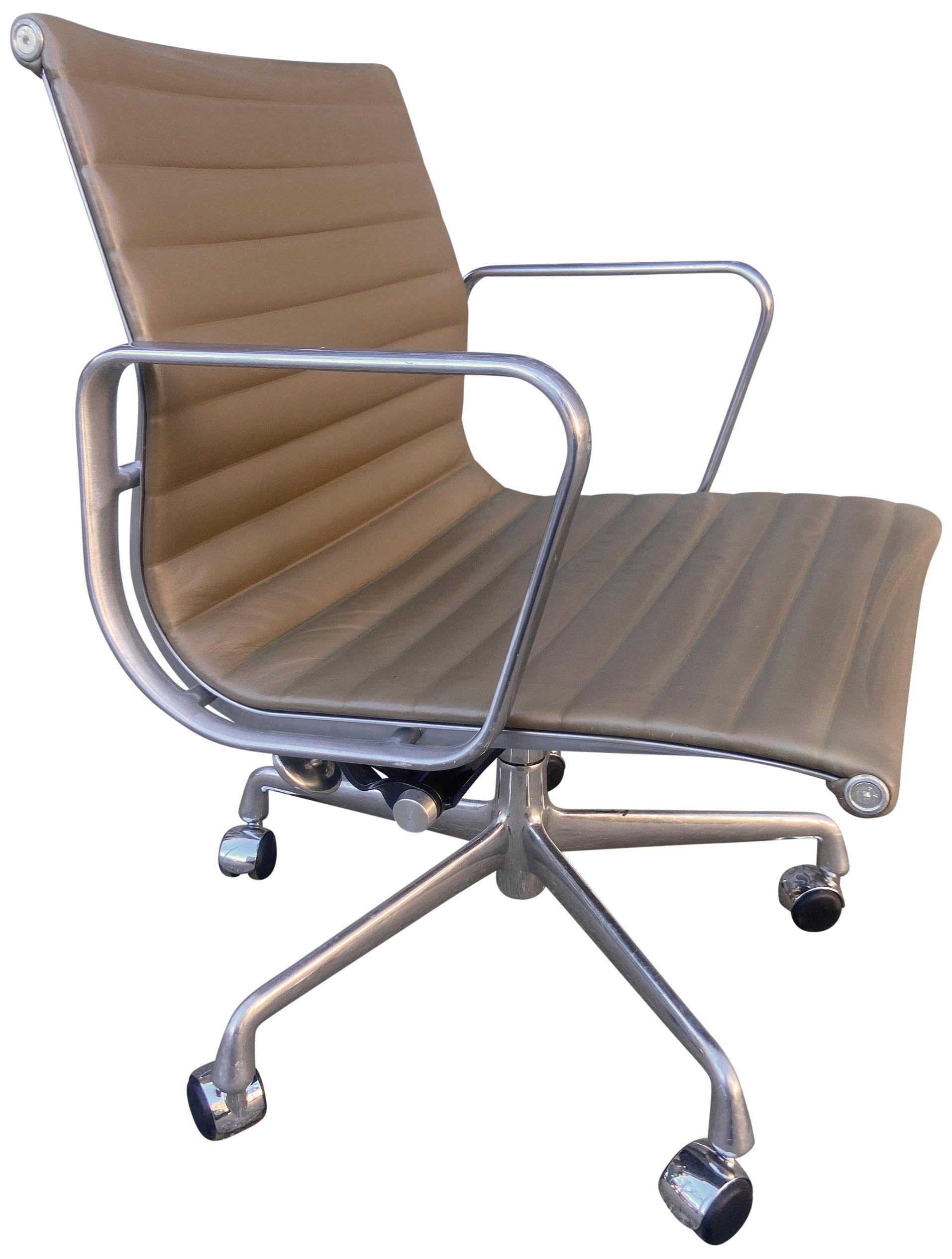For your consideration we have up to 7 Eames for Herman Miller executive chairs in beige / light brown leather with low backs. These are from 2000s full tilt, manual height adjustment, and swivel with carpet / hardwood casters. Typical marks and