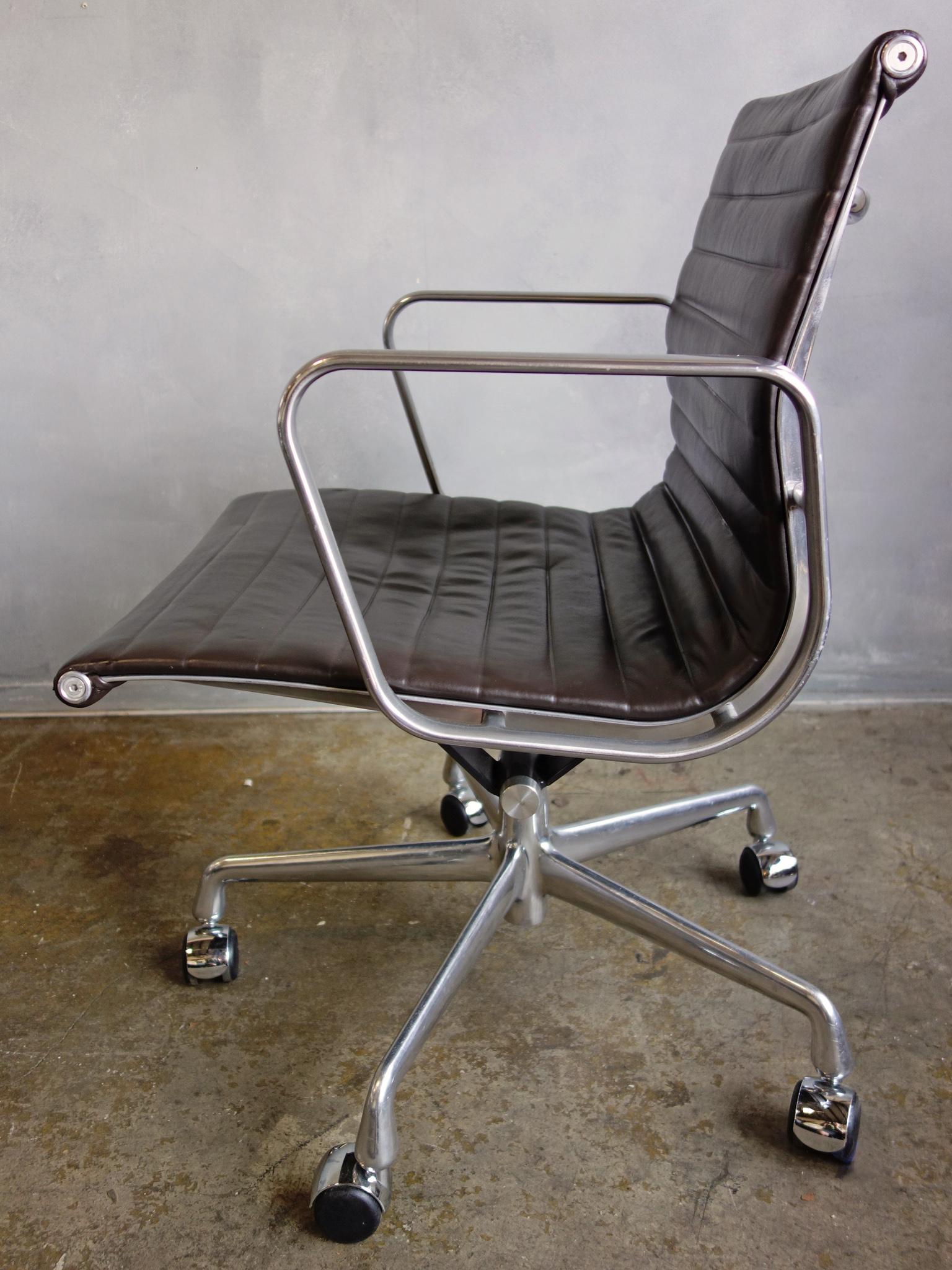 For your consideration are up to 12 midcentury Eames side chairs upholstered in Espresso Brown leather. Elegance and comfort separates this iconic chair from the rest. First produced in 1958 and still in production makes this one of the most sought