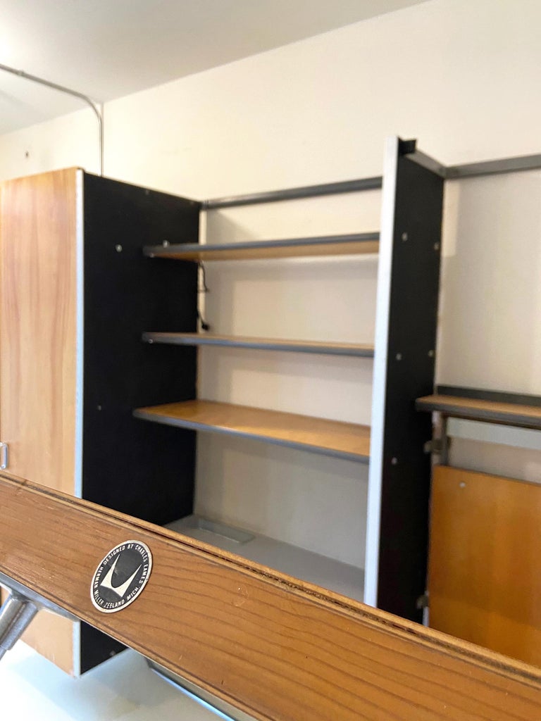 For your consideration this is extremely rare Eames wall unit produced in 1961. The ECS are seldom found and only produce for a short period of time.
Featuring three sections that include a fold down bed on the right side, a desk with shelves in