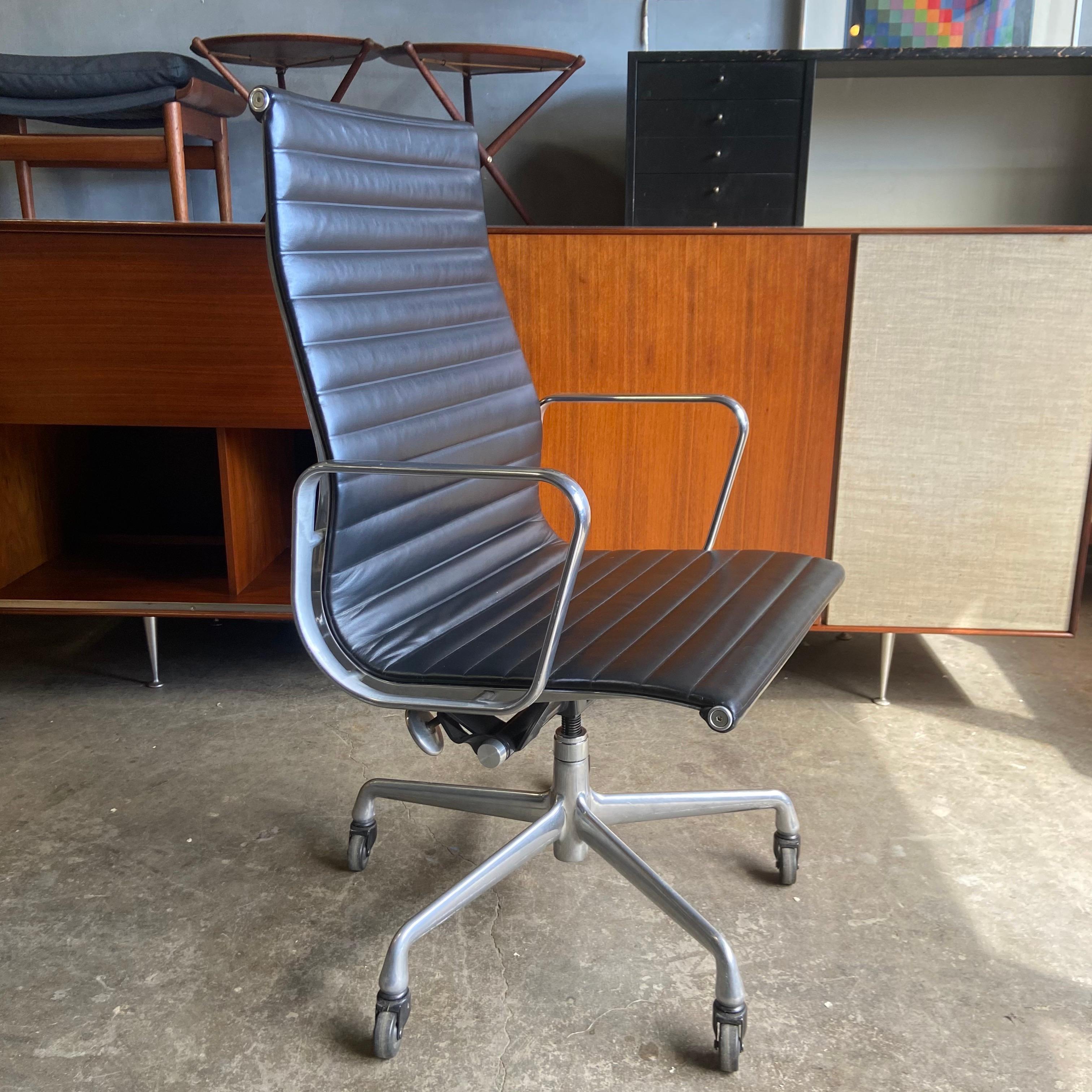 For sale are these authentic Eames for Herman Miller Aluminum Group chairs in black leather with high-backs. An icon of Mid Century Modern design that continues to be produced today. Manual height and tilt. 
In almost like new condition, but does