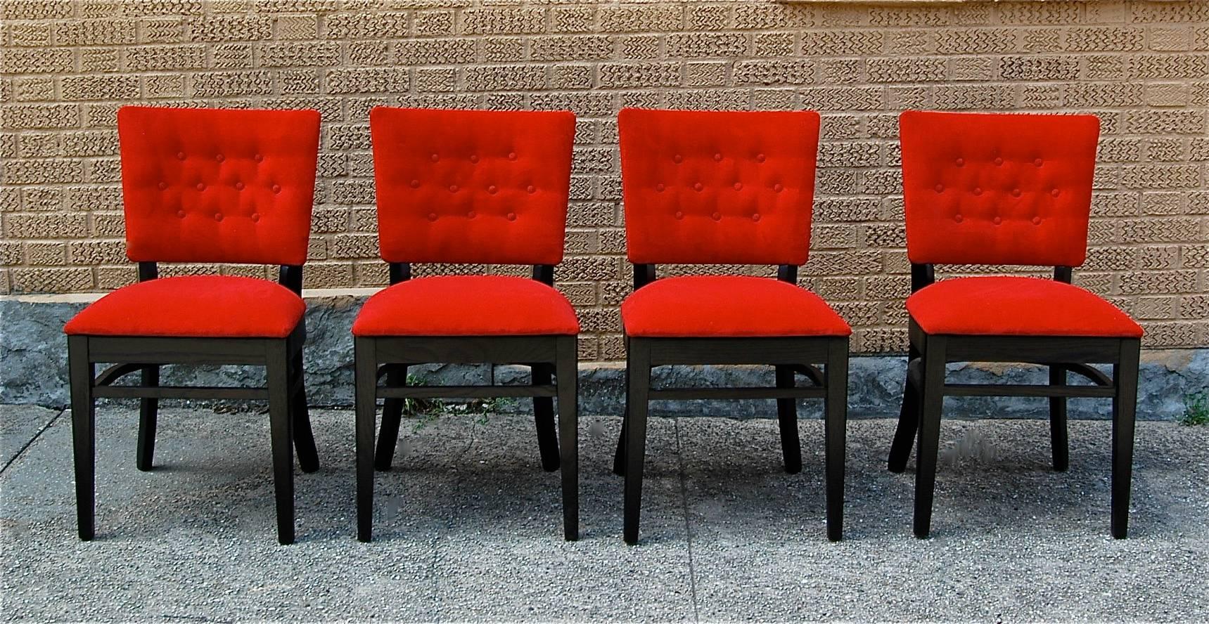 Set of four, midcentury, café dining chairs feature ebonized oak frames with red velvet upholstery. Sold as a set of 4.
