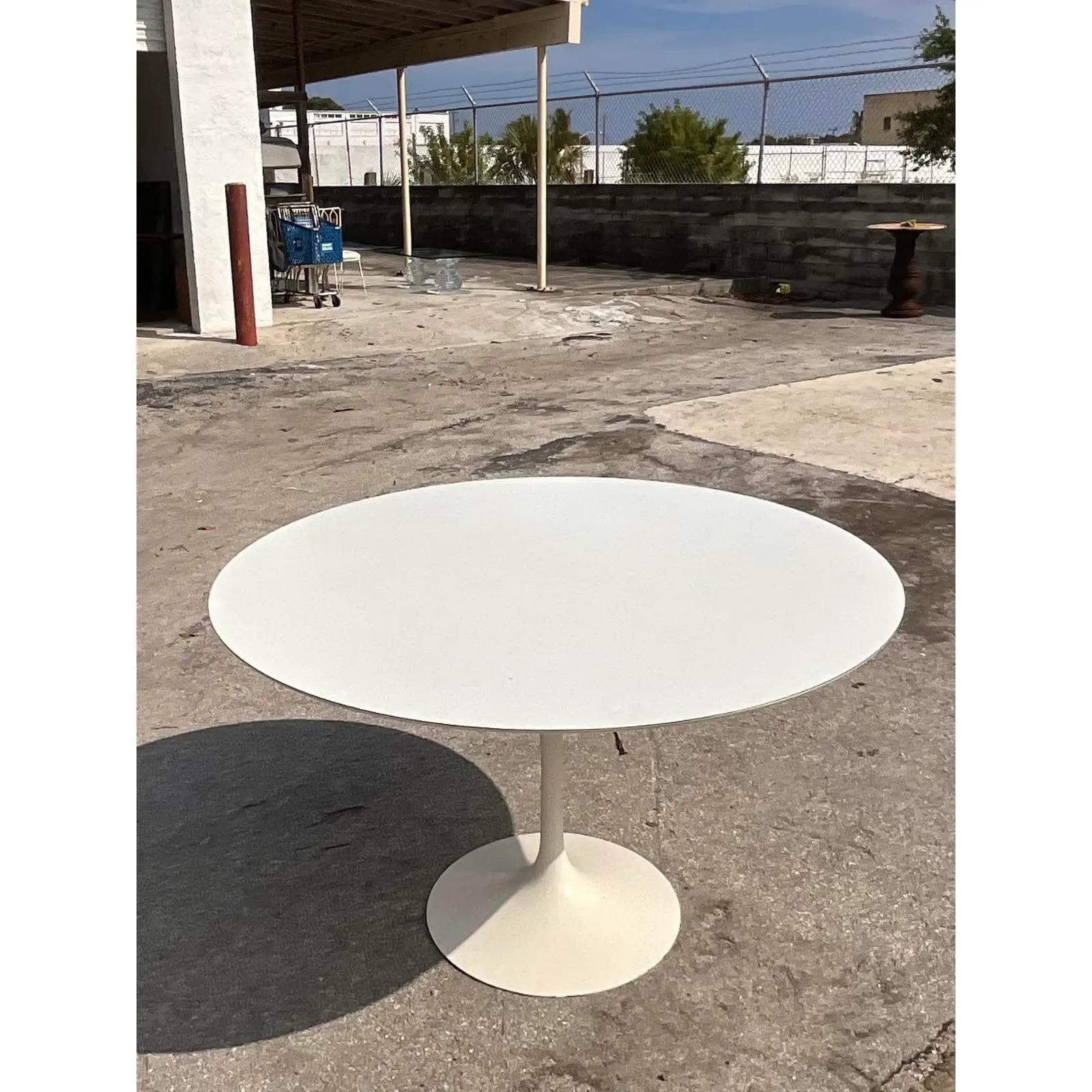 Fantastic vintage MCM dining table. Designed by Eero Saarinen for Knoll International. The iconic tulip shape with a classic round top. Purchased directly from Knoll in NYC. Made in Italy. Acquired from a Palm Beach estate.
