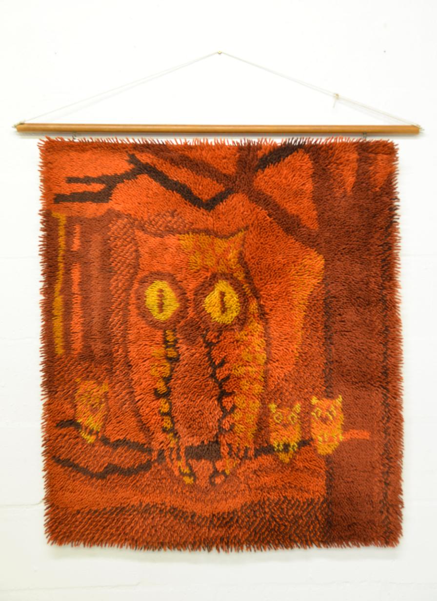 A rare Scandinavian RYA wall hanging tapestry designed in the 1970s for EGE Rya, a subsidiary of Denmark's prestigious carpet manufacturer, EGE Taepper. The bold and whimsical design depicts a colourful abstract owl with three baby owls sat on a