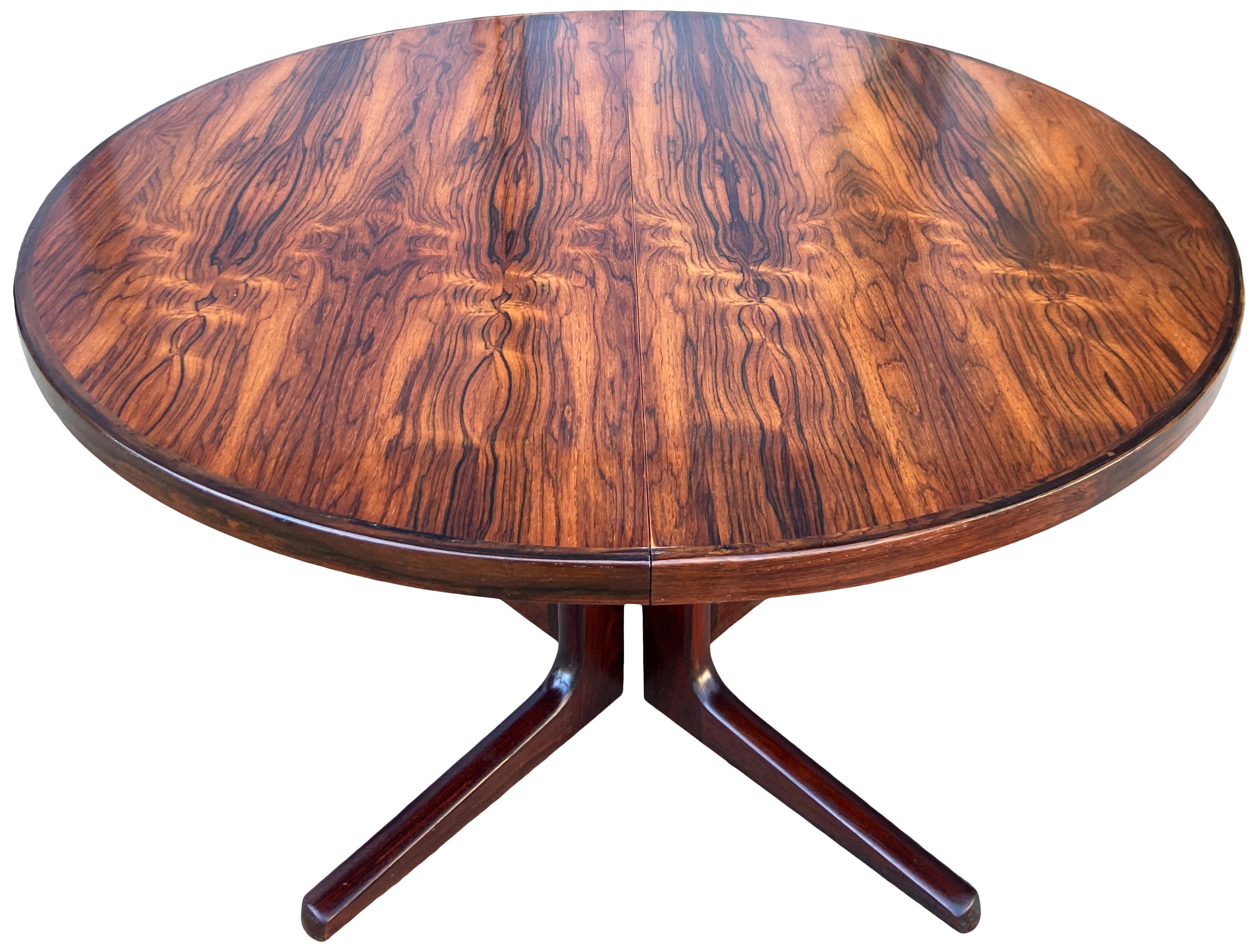 For your consideration is this beautiful rosewood dining table. The height is 28 1/2 with the knee hole 27