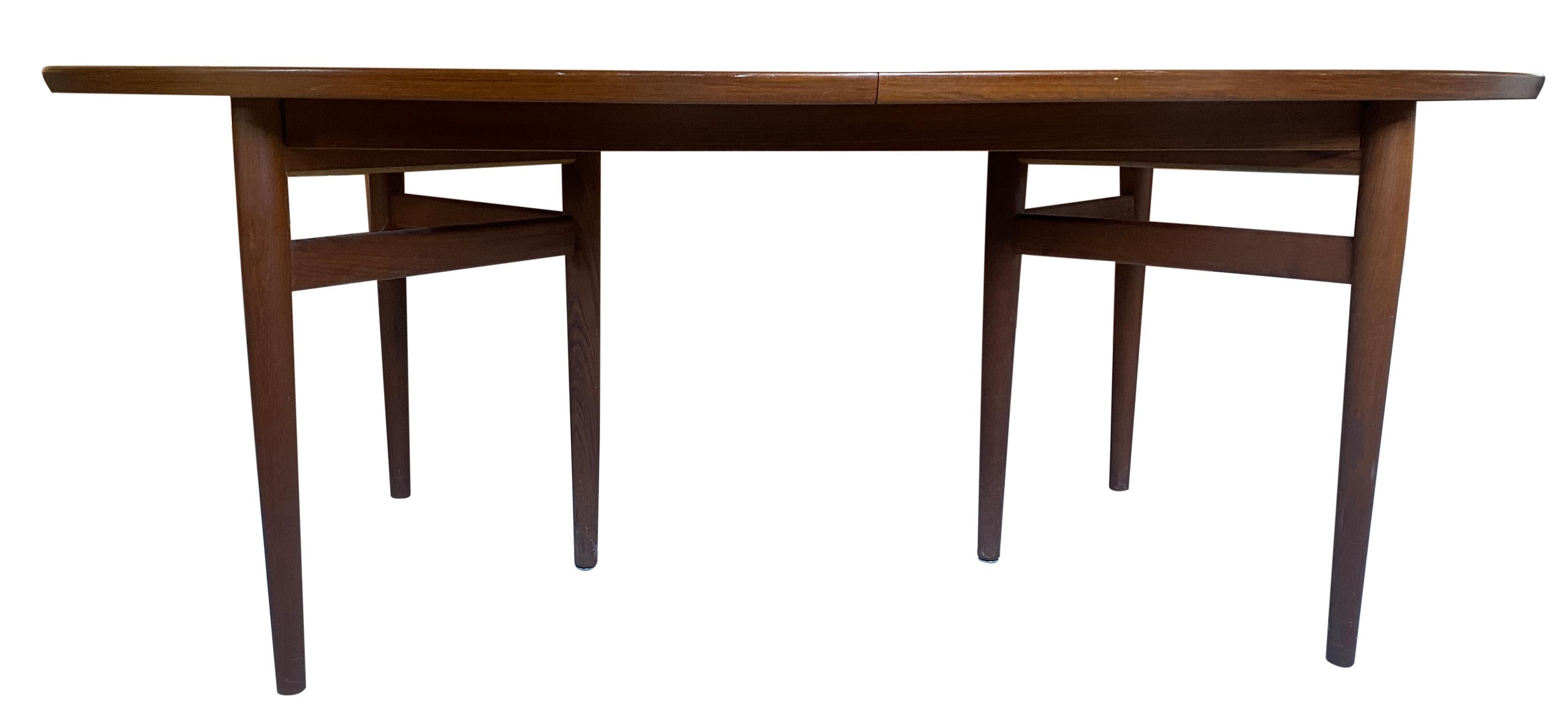 Midcentury teak elliptical oval Danish extension dining table with (2) leaves designed by Arne Vodder. Model no. 212. Made by sibast in Denmark. This table is very high quality hand built in Denmark. Solid teak tripod legs. This table is in
