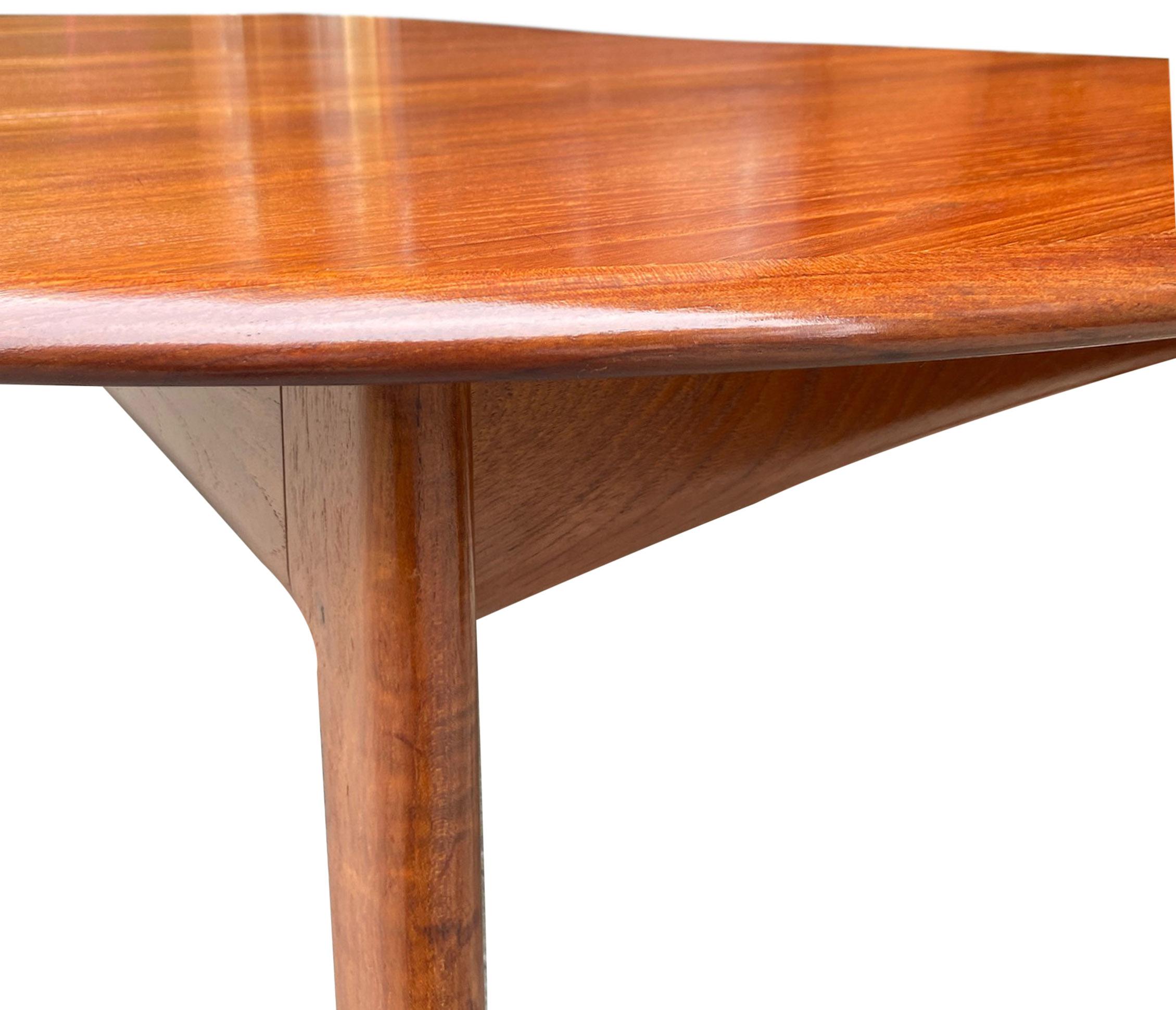 For your consideration is this gorgeous teak dining table designed by Svend Madsen. Featuring two 24'' leaves with no fading. Fully closed the table is 48'' round. The table fully extended is 96'' long. The kneehole is 23.75''. This beautiful and