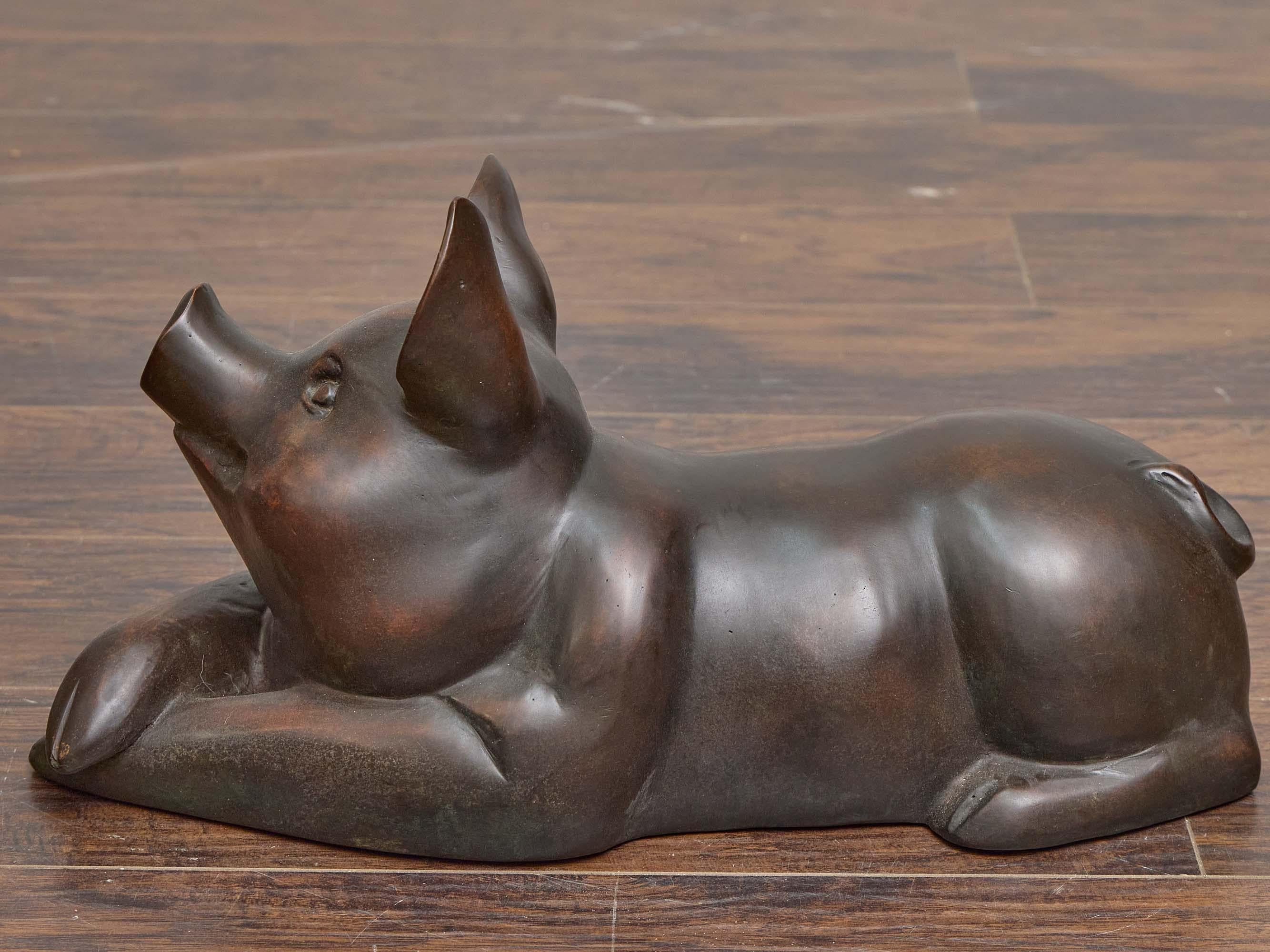 Patinated Midcentury English Bronze Reclining Pig Sculpture with Naturalistic Detail For Sale