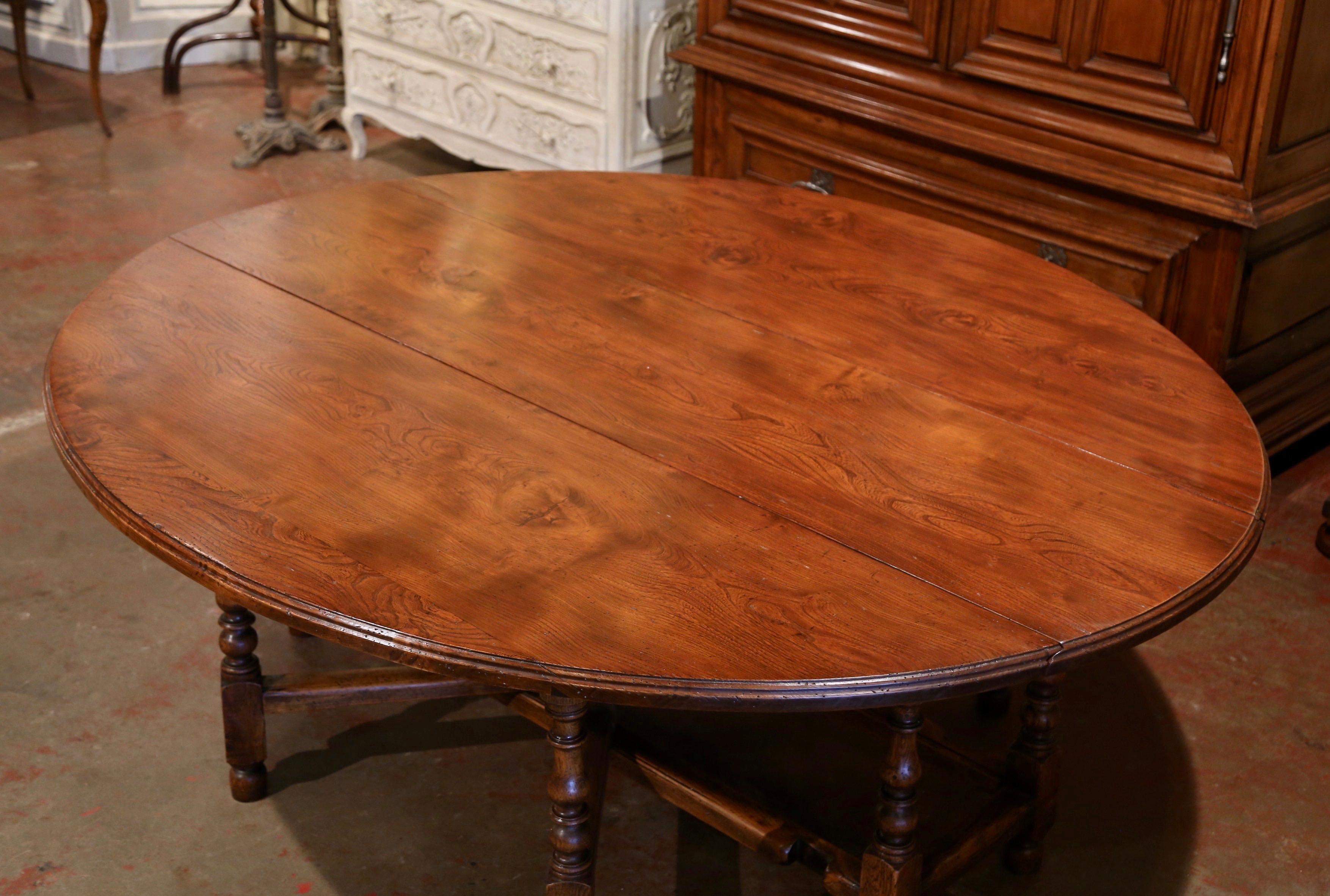 Patinated Midcentury English Carved Chestnut Eight Gate-Leg Drop-Leaf Oval Table