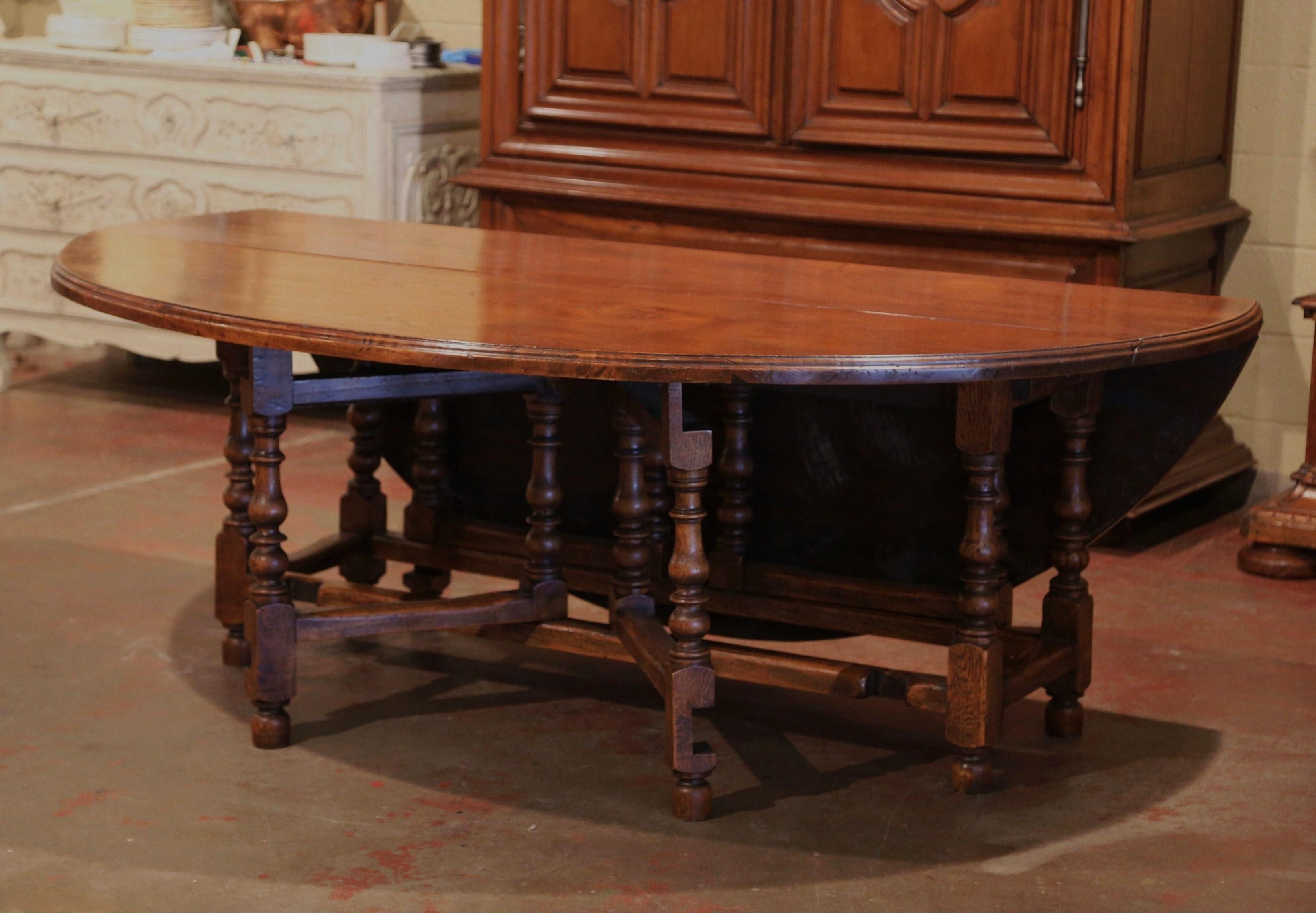 20th Century Midcentury English Carved Chestnut Eight Gate-Leg Drop-Leaf Oval Table