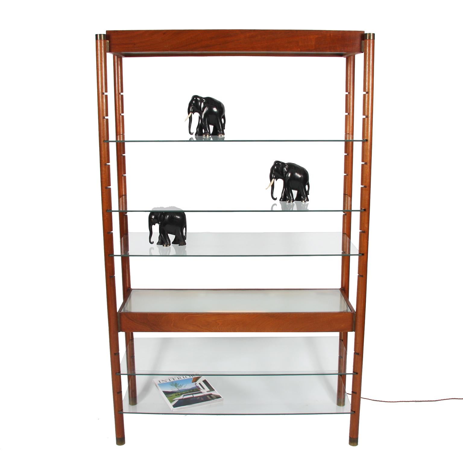 English 1960s

A wooden and glass bookshelf, with two lit shelves. Shelves are adjustable. 

Rewired and PAT tested. With twisted silk flex.
  