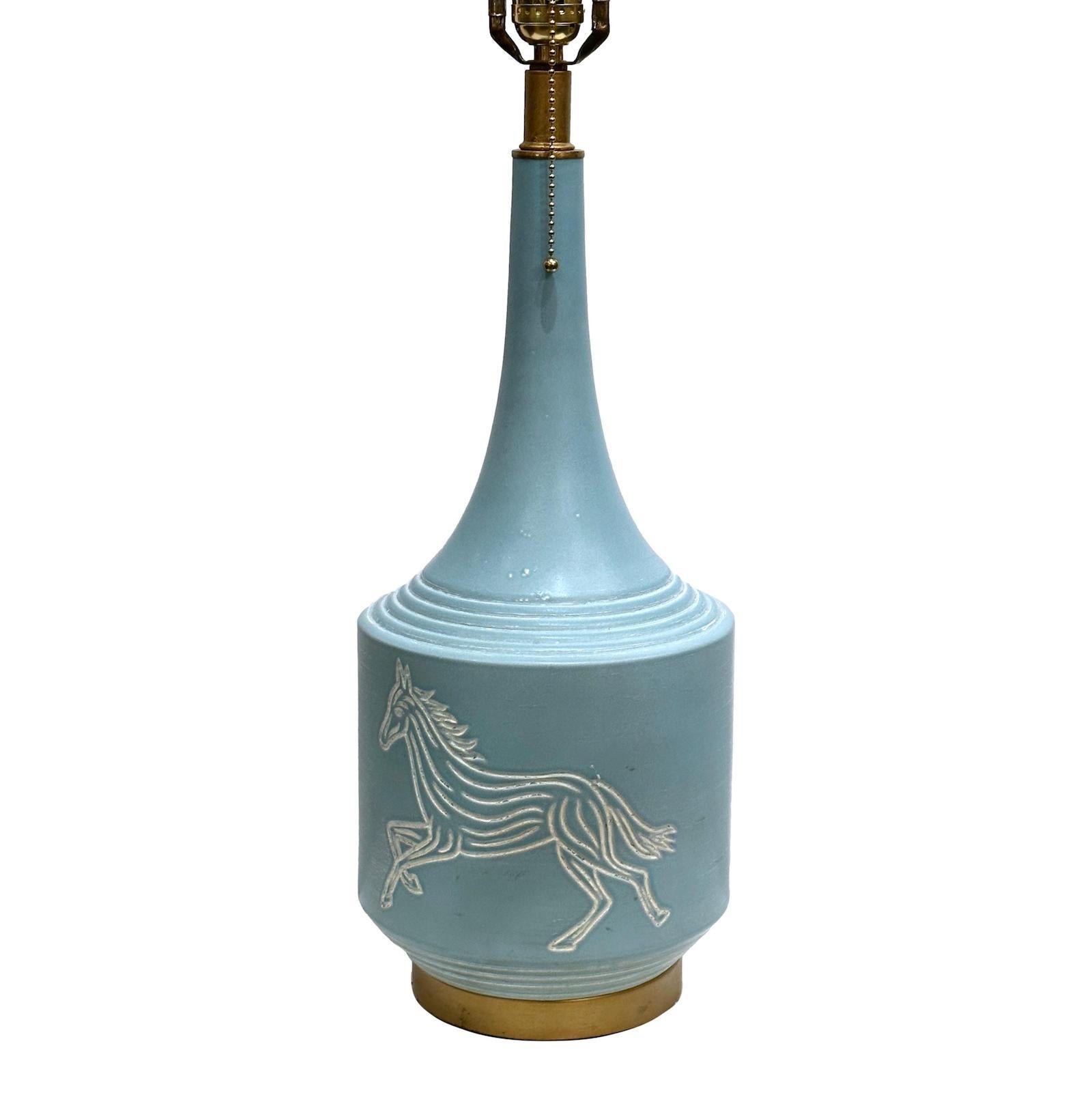 An Italian circa 1960’s single porcelain table lamp with horse motif on both sides.

Measurements:
Height of body: 19
Height to shade rest: 28
Diameter: 7.5.