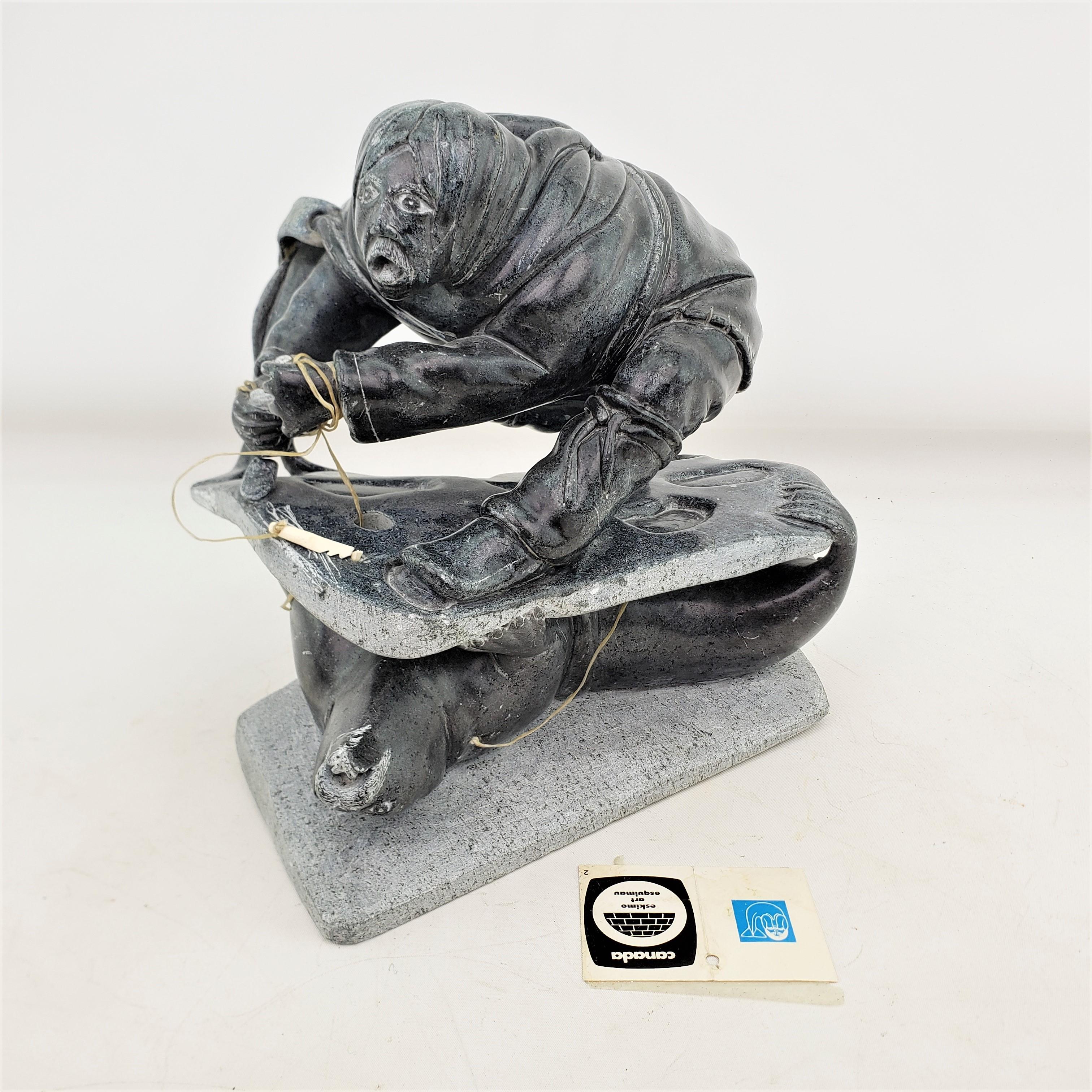 Midcentury Era Akulivik Region Inuit Soapstone Carving of a Man Seal Hunting For Sale 3