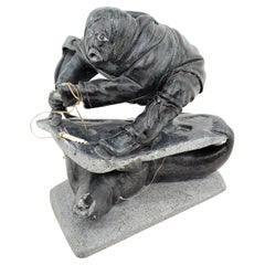 Midcentury Era Akulivik Region Inuit Soapstone Carving of a Man Seal Hunting