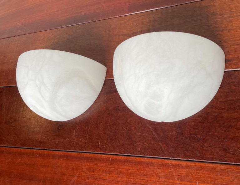 Stunning, timeless and easy to mount pair of alabaster wall sconces.

If you are looking for a stylish and timeless way to bring light into your entry hall, landing, kitchen or bedroom or if you are looking for the perfect wall lights over your