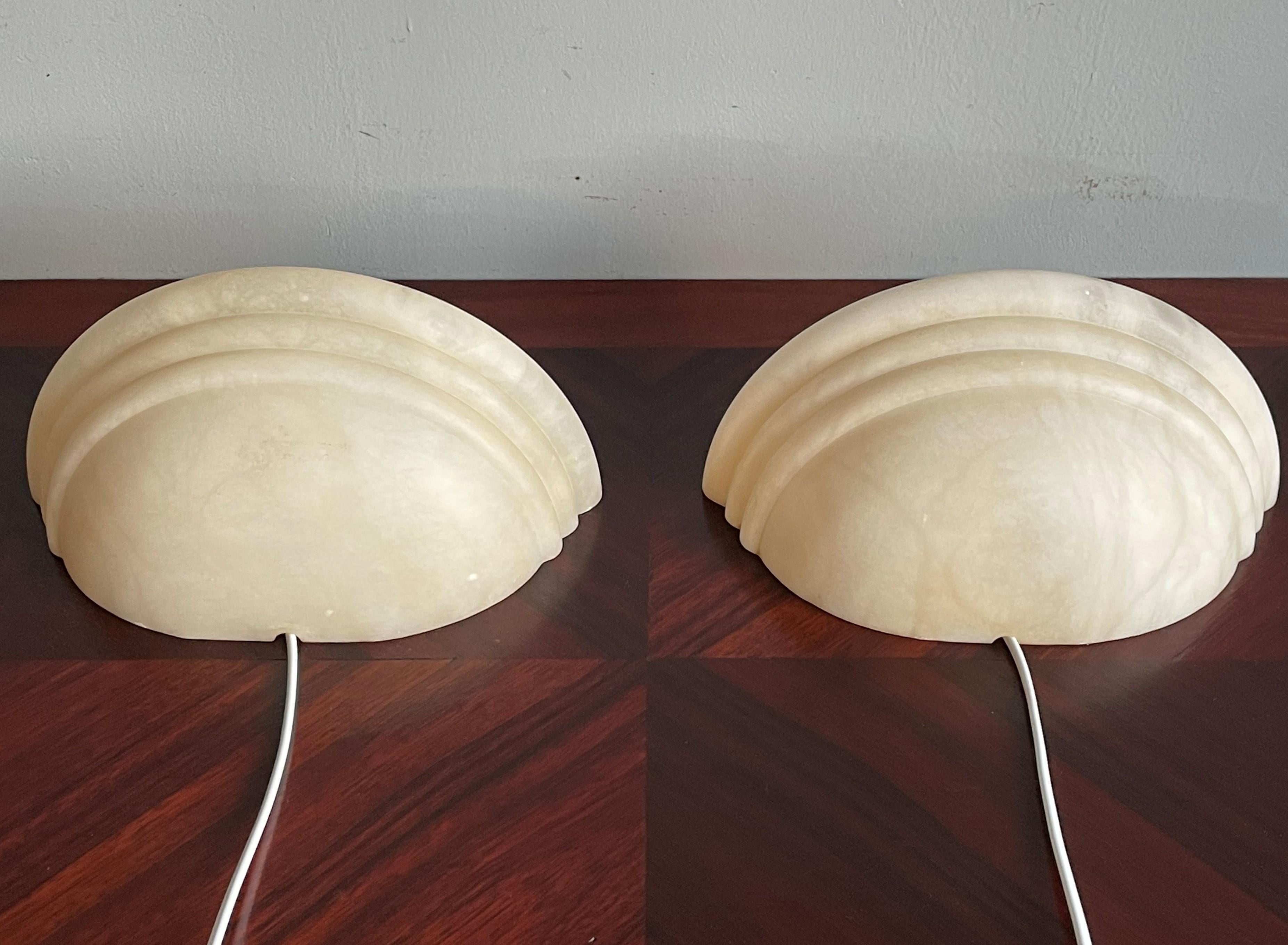 Wonderful looking and easy to mount pair of alabaster wall lights.

If you are looking for a stylish and timeless way to bring light into your entry hall, bathroom, kitchen or bedroom or if you are looking for the perfect wall lights over your