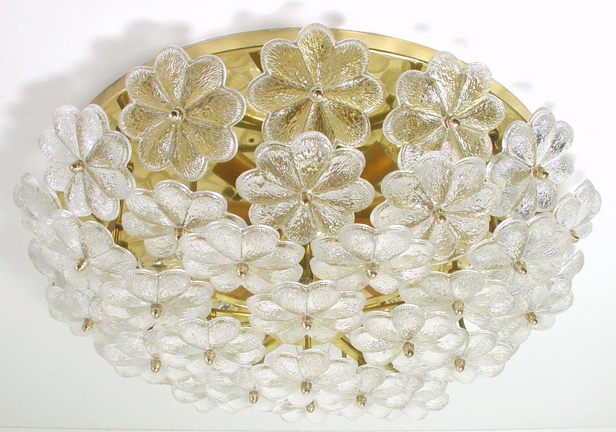 This beautiful flush mount or sconce was manufactured in Germany by Ernst Palme in the 1960s.
It is made of brass and has got 42 Murano glass blossoms. Very heavy quality.

The fixture requires 6 E14 standard bulbs with 40W max each and is