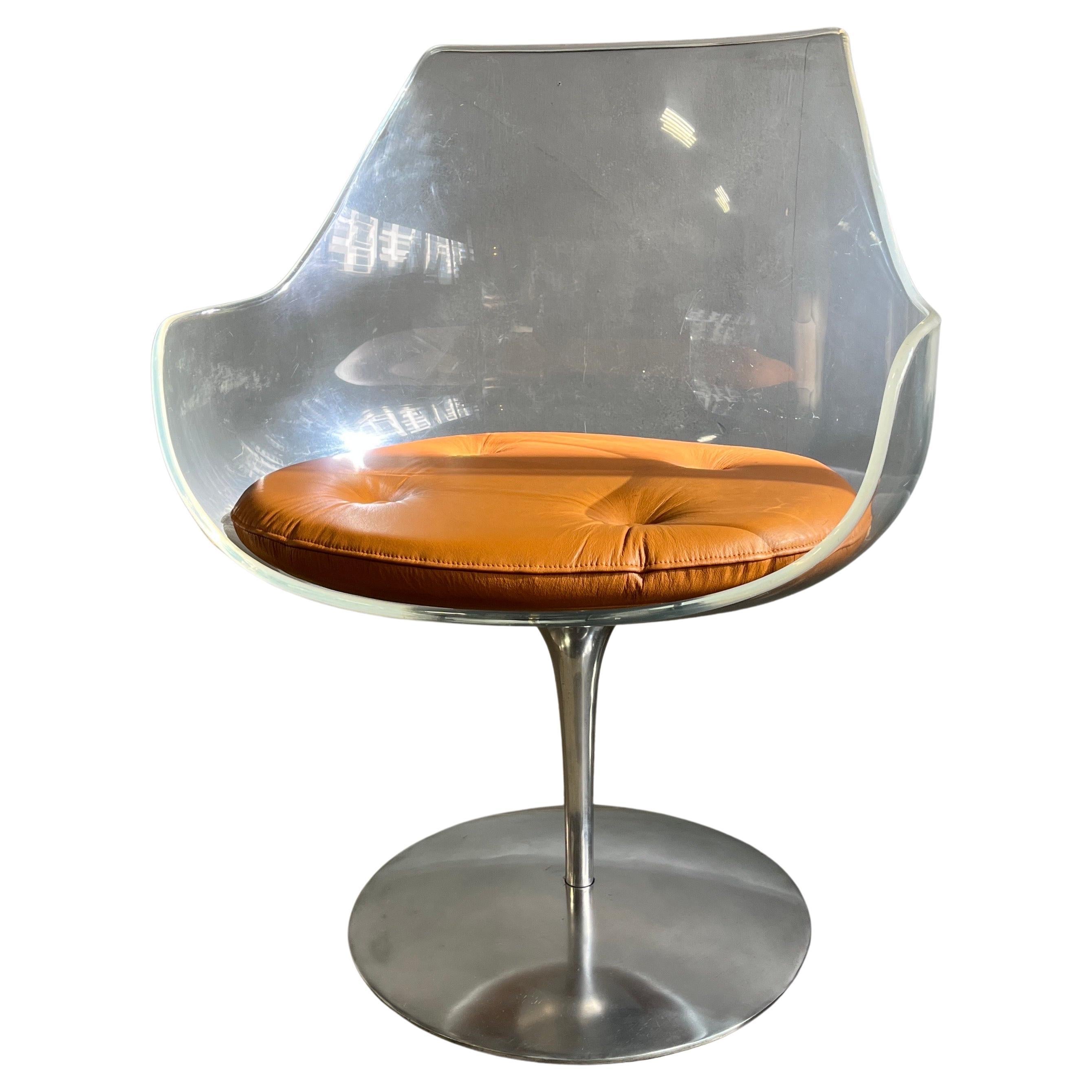 Erwine & Estelle Laverne invisible series Lucite and polished aluminum Champagne swivel chair. New leather cushions. Rare, clean early examples. 

Fully signed on bottom: Laverne, NY-22, chair base, #1, circa 1957-1960. Good condition.

Priced per