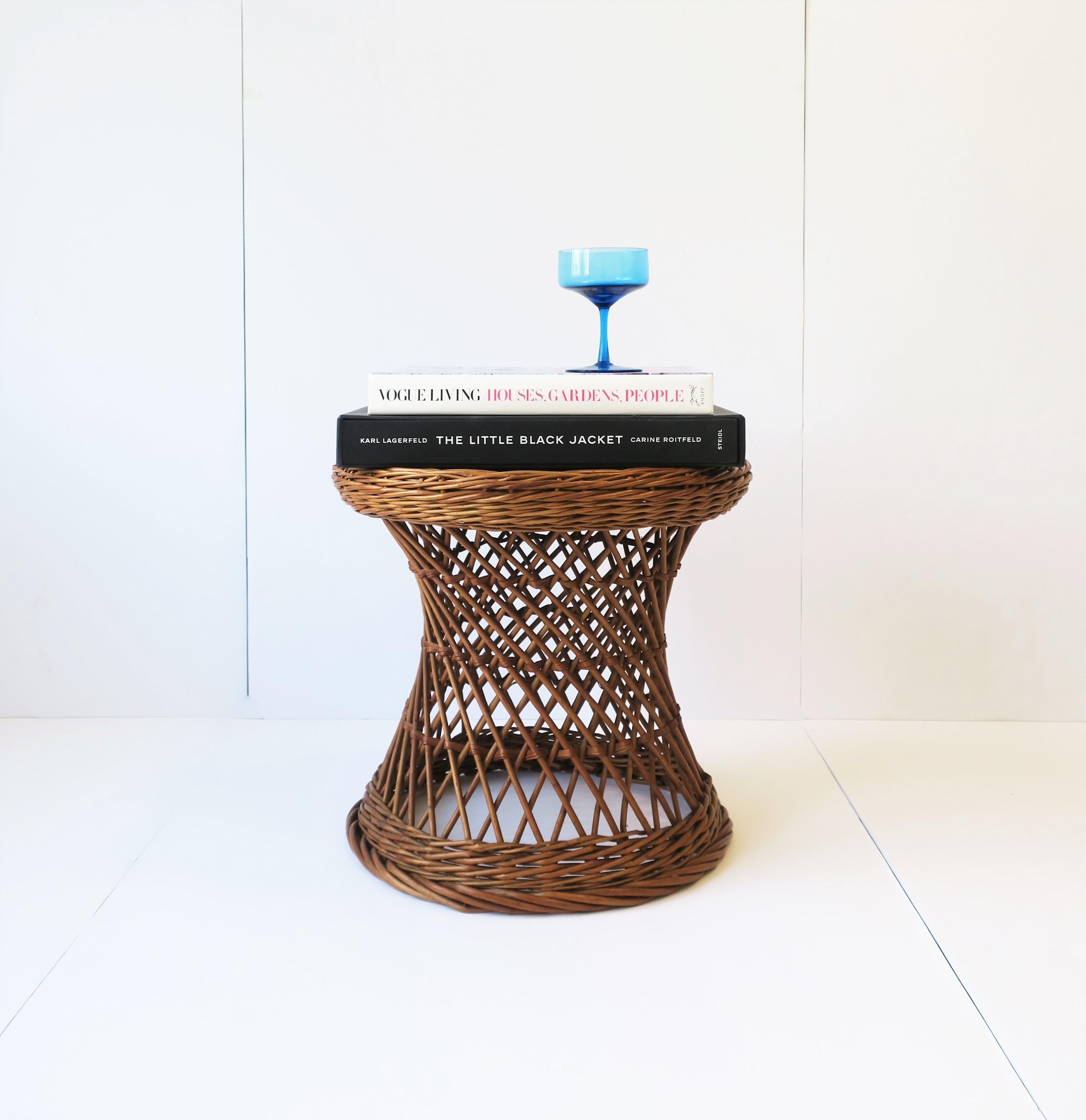 A vintage Midcentury European wicker stool or side table with hourglass design. Marked 'made in Yugoslavia' as shown in image #14. Piece can be used as a side table (as demonstrated in images) or stool. Dimensions: 17