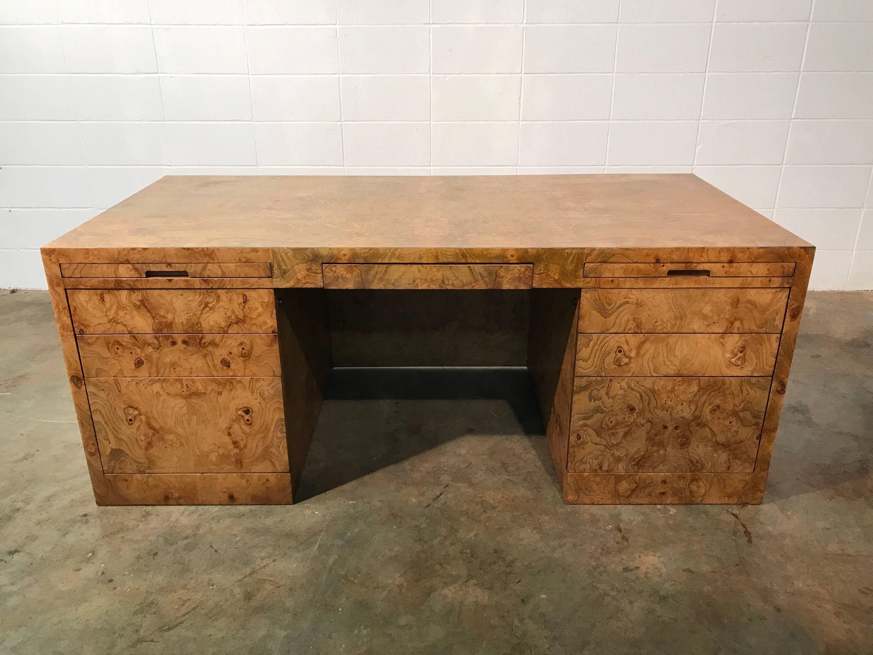 Midcentury executive desk in burl wood by Directional Furniture
Amazing executive desk fully wrapped in burl = show stopper
Desk features seven drawers and two pull-out surfaces for ample work space. Very solid and high quality craftsmanship. Desk