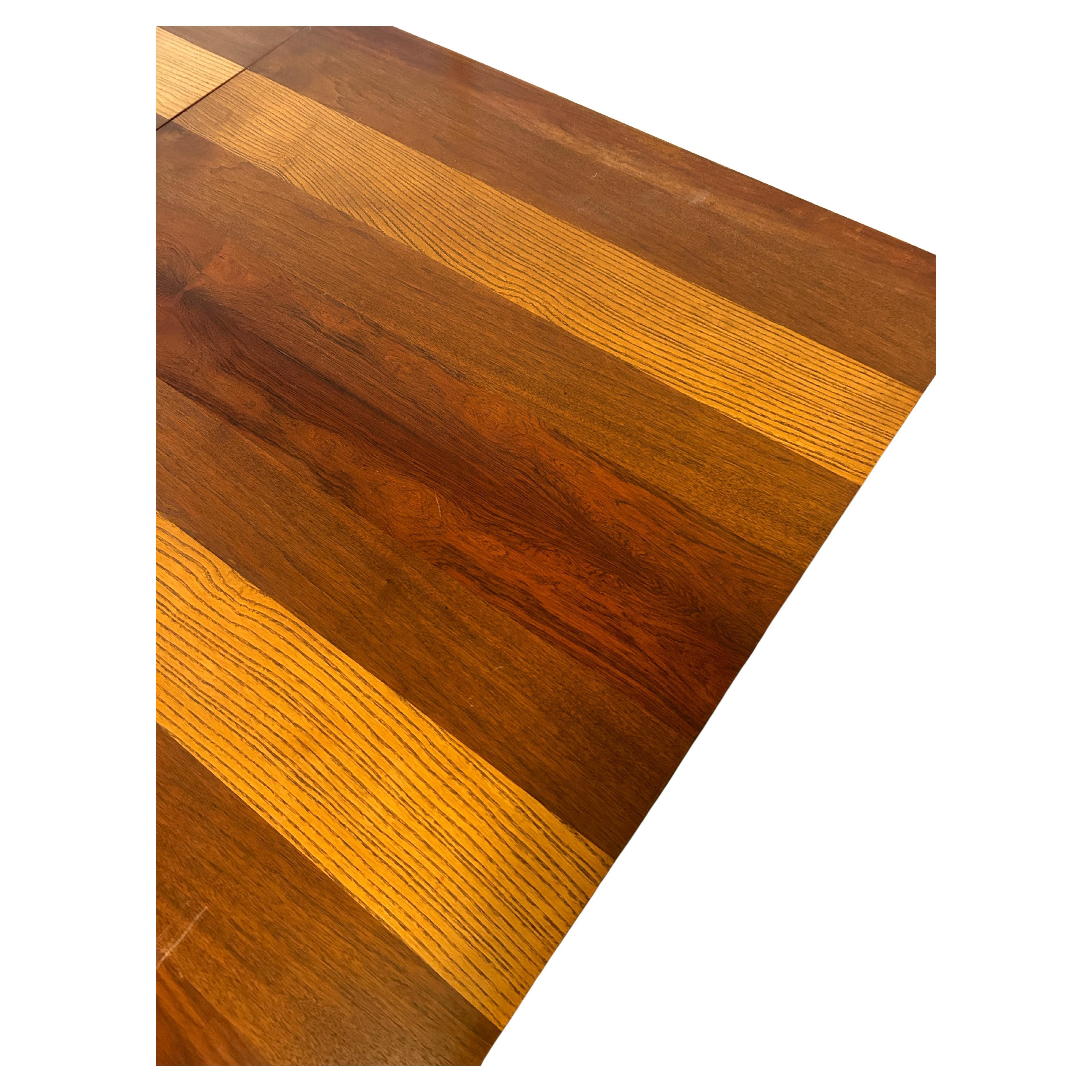 Mid-Century Modern American Danish style dining table by Milo Baughman. Beautiful tri-wood veneer table made in USA. Amazing teak, rosewood and walnut table that doesn't make you choose what type of wood fits your space. You can have all three!